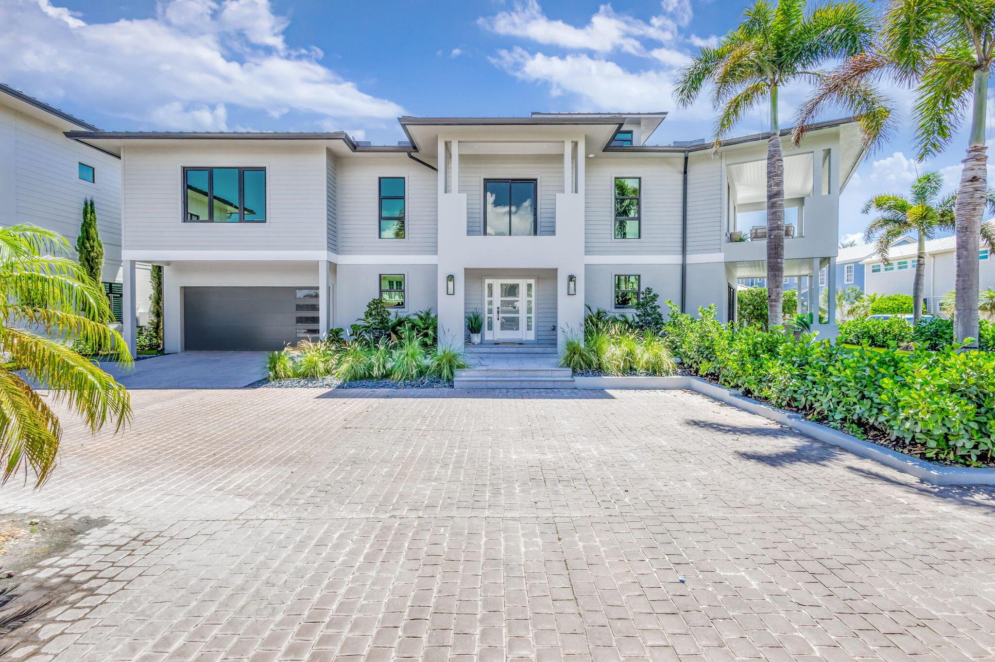 Welcome to your private paradise!! RARE opportunity to own this BRAND NEW CONSTRUCTION residence just steps from one of Florida's most beautiful beaches!! This stunning home is privately nestled in the exclusive enclave of Xanadu By the Sea. Masterfully designed with impeccable craftsmanship that embodies modern luxuries, yet captures the intimate feel of a coastal retreat!