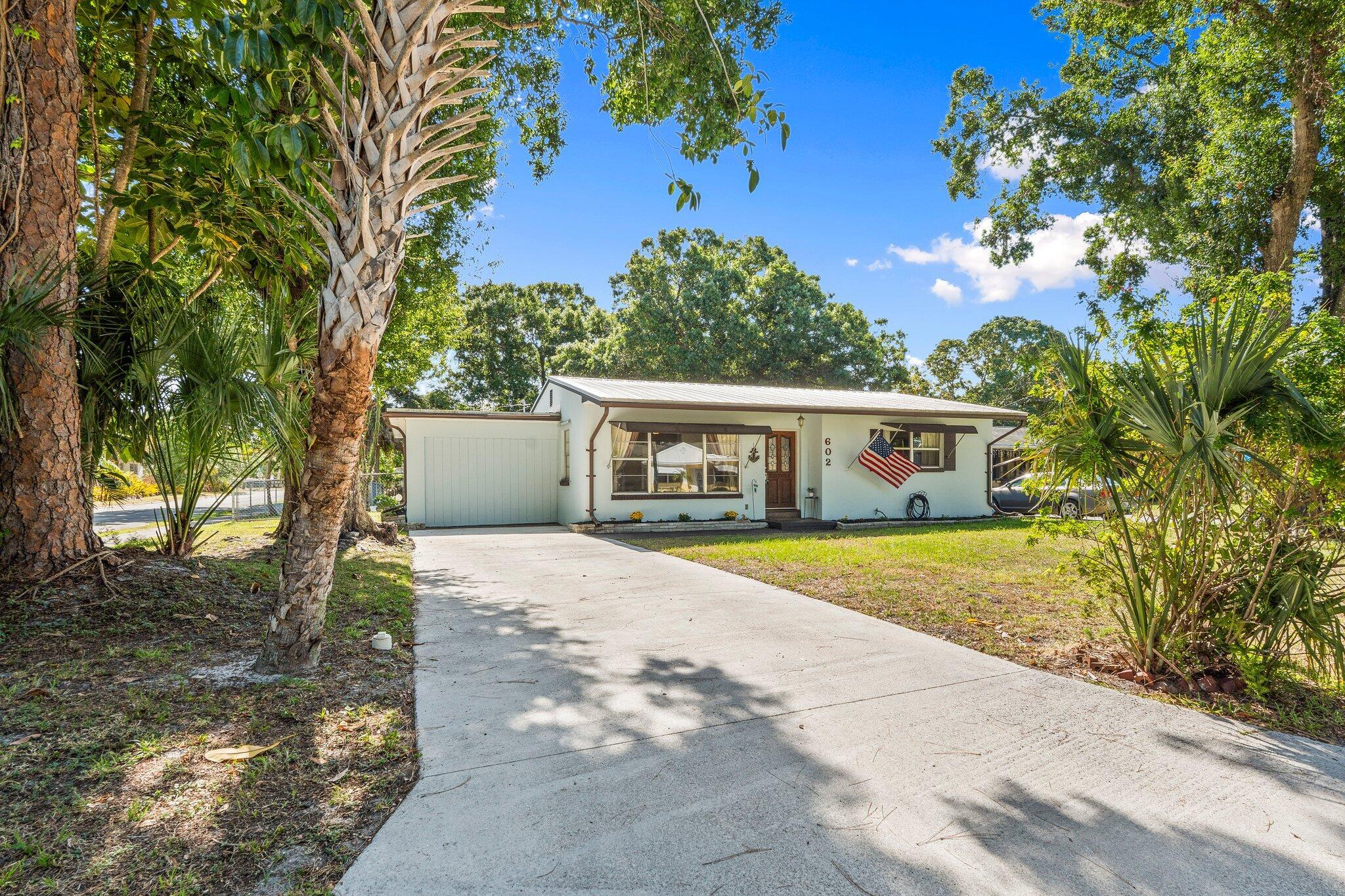 Charming 2-bedroom, 1-bath home on a spacious, tree-lined corner lot. Built with durable concrete block construction and topped with a long-lasting metal roof, this home offers both comfort and peace of mind. Enjoy a fully fenced yard--perfect for pets or outdoor living--along with a handy storage shed. The garage has been converted into a versatile bonus room that can serve as a 3rd bedroom, home office, or hobby space. A screened-in porch completes the package, providing a relaxing spot to unwind. Flexible space and solid construction make this a must-see!