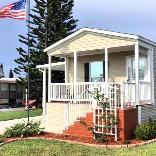LOT LEASE $775. Charming 2019 manufactured home in Sandhill Shores (55+ community) featuring 2 beds, 1 bath, laminate flooring throughout with chair rail moldings. Classic front porch with stain decking and stairs and beautifully landscaped surroundings. Located in a +55 plus community with a land lease $775 that includes lawn care, and access to community amenities like a pool, fitness center, billiards, and clubhouse. Call for a showing today!
