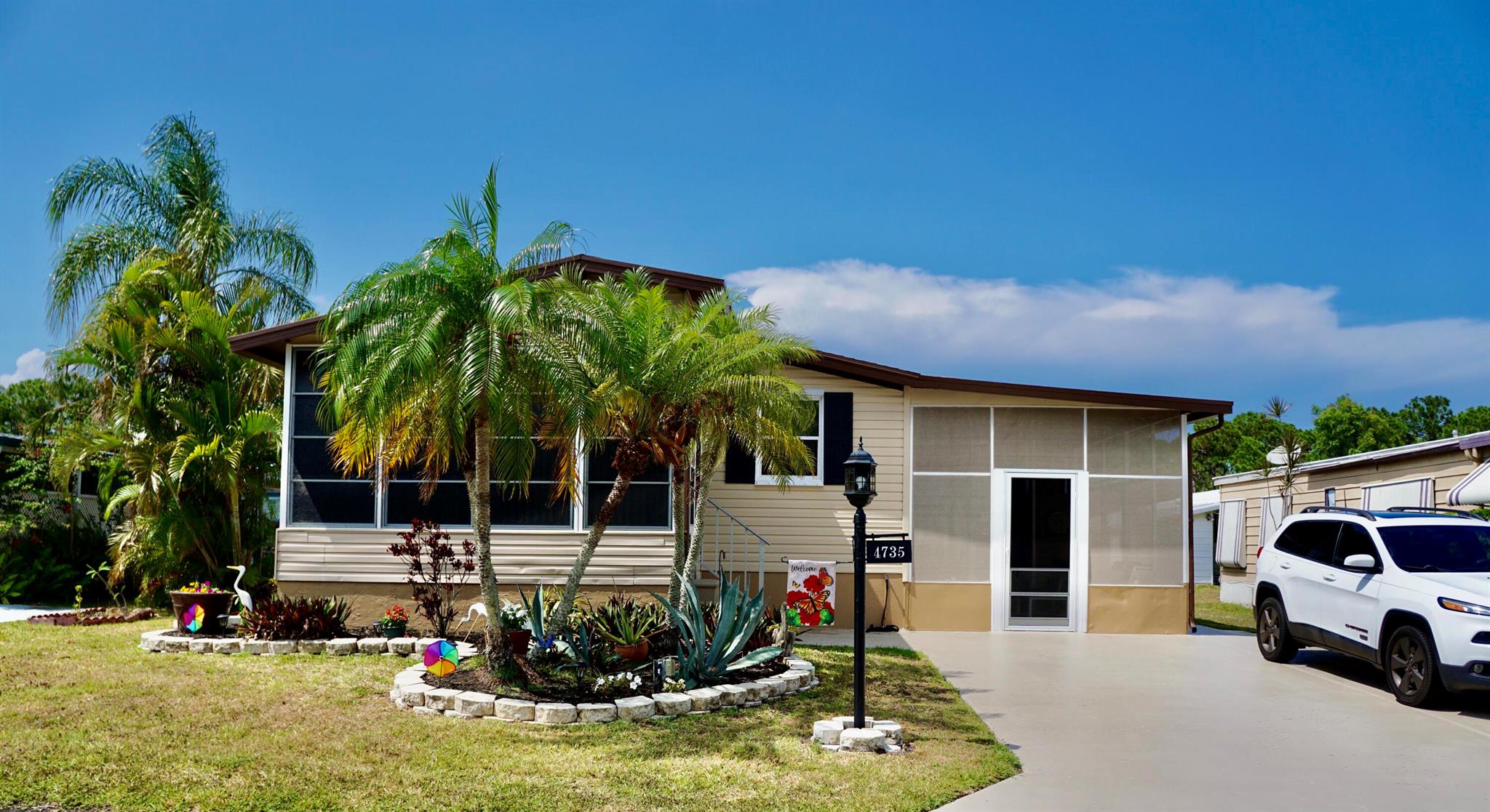 Enjoy RELAXED living in this beautifully maintained & clean 2BR/2BA home. Located in a 55+, pet friendly community with resort like amenities. Pay NO PROPERTY TAX as your land lease pays it all!  Plenty of space for entertaining friends and family. The open kitchen, flows into the large family room which also opens to the 140sf air-conditioned sunroom. Enjoy a cup of coffee or glass of wine on your 264sf screened porch. Bathrooms have been updated. Washing machine & dryer are included. 12x10 shed for tools and pool floats. $828 land lease covers property tax & community amenities including swimming pool, hot tub, community room, billiards, fitness center, tennis & more. Quiet neighborhood near the beach, restaurants, & hospital. Furniture negotiable! Just move in and Relax. Call Today!