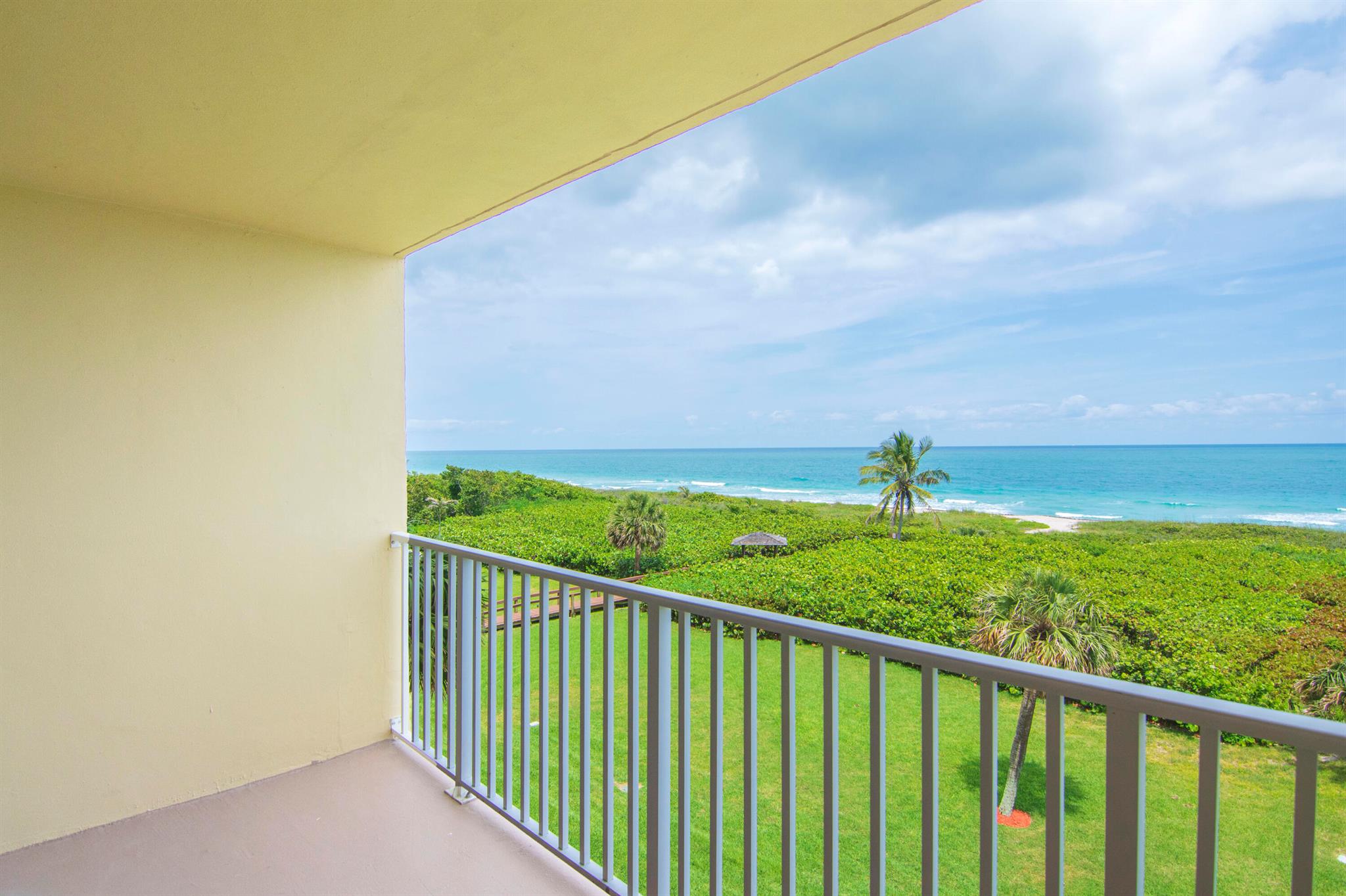 Spectacular Wide Ocean Views From This 4th Floor Condo Going Out To The Atlantic For Miles And Miles,Extraordinary View Of The Beach! Relax Out On Your Balcony Sipping Latte And Enjoying The Ocean Breezes. Come Live The Florida LifeStyle! Remodeled With Tiled Living Area And Kitchen,Laminate WaterProof Flooring In Bedrooms. Sea Palms With Full Deeded Private Beach Access,Pool,Tennis Courts & More! Sewer,Water,Trash Included. Unit Has Brand New A/C & HWH,Hurricane Accordion Shutters Wrap Around For Full Protection. Convenient To Harbortown Marina,Restaurants,Navy Seal Museum And Pepper Park Beach!