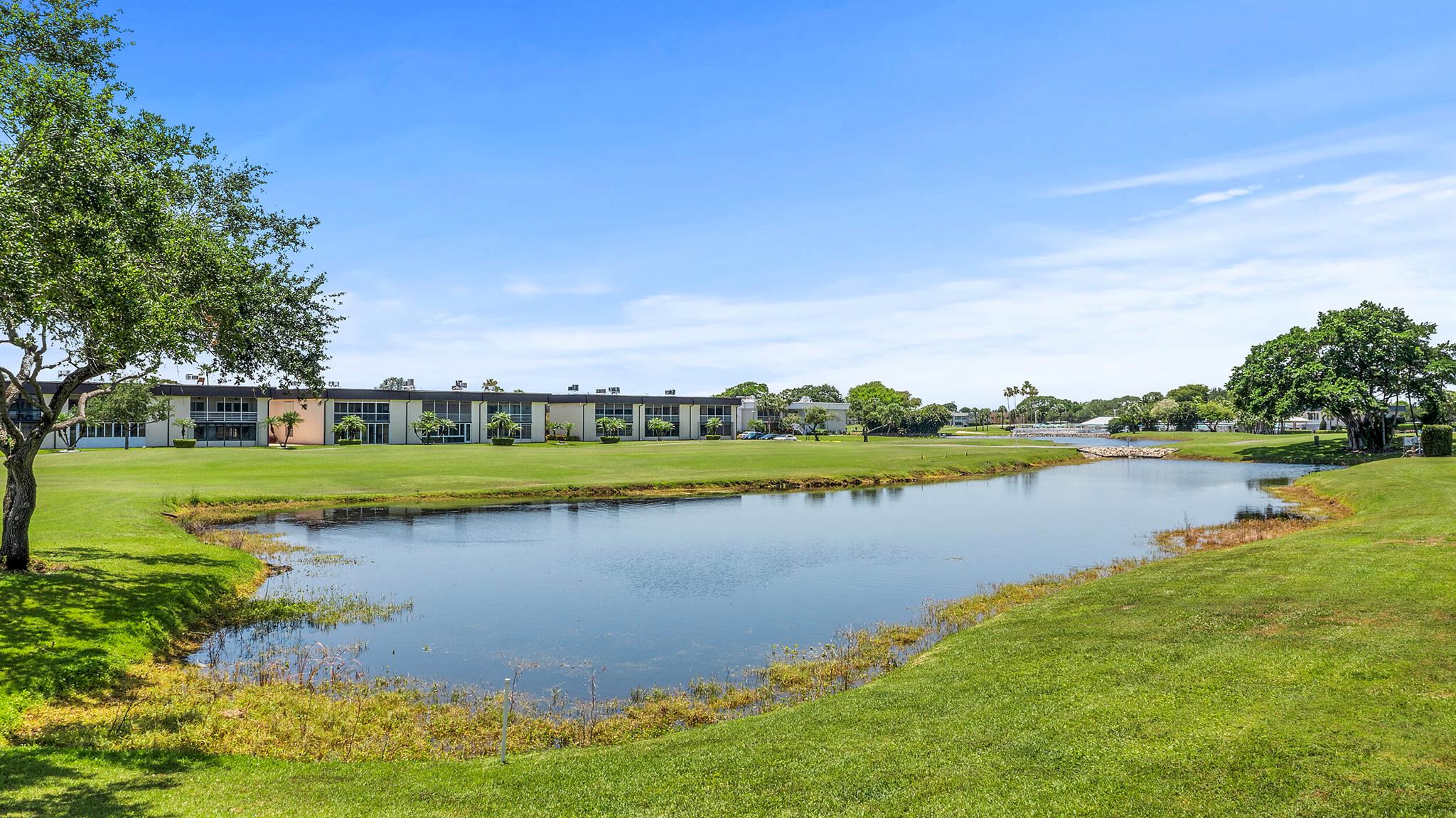 Welcome to the lap of luxury--only the best of the best! This stunning, fully renovated and freshly painted ground-floor 2 bed / 2 bath CBS condo in the exclusive 55+ Kings Point Golf & Country Club boasts all-new impact windows and a gorgeous A/C-cooled enclosed impact patio with breathtaking golf course and water views. Inside, enjoy a custom-designed kitchen with real wood soft-close white shaker cabinets, quartz waterfall countertops, quartz backsplash, brand-new top-of-the-line stainless steel appliances, a touchless faucet, oversized designer sink, and a built-in desk area. The home features 2023 A/C, Pro Series  thermostat, water heater, electric panel, recessed lighting, ceiling fans, modern fixtures, waterproof engineered hardwood flooring throughout, no popcorn ceilings, upgraded switches and outlets, and beautiful new doors with designer hardware. The spa-like bathrooms offer floor-to-ceiling tile, frameless glass showers, LED mirrors, and a frosted glass pocket door separating the primary suite. The master bedroom includes a modern frosted glass pocket door for easy access to the patio, and both closets feature custom, freshly installed shelving for organized, efficient storage. The guest bedroom features a brand-new modern Murphy bed with extra storage and a work desk for added convenience and space. The laundry closet includes a new full-size Samsung washer and dryer for added convenience. This condo is truly one-of-a-kind&#x14;essentially brand new! Kings Point offers two 18-hole golf courses, indoor and outdoor pools, tennis courts, a theater, caf+¬, bistro, and is just minutes from downtown Delray and the beach. Seller financing available with substantial down payment and attractive terms, Flexible options for qualified buyers! This is a must-see&#x14;schedule your showing today!