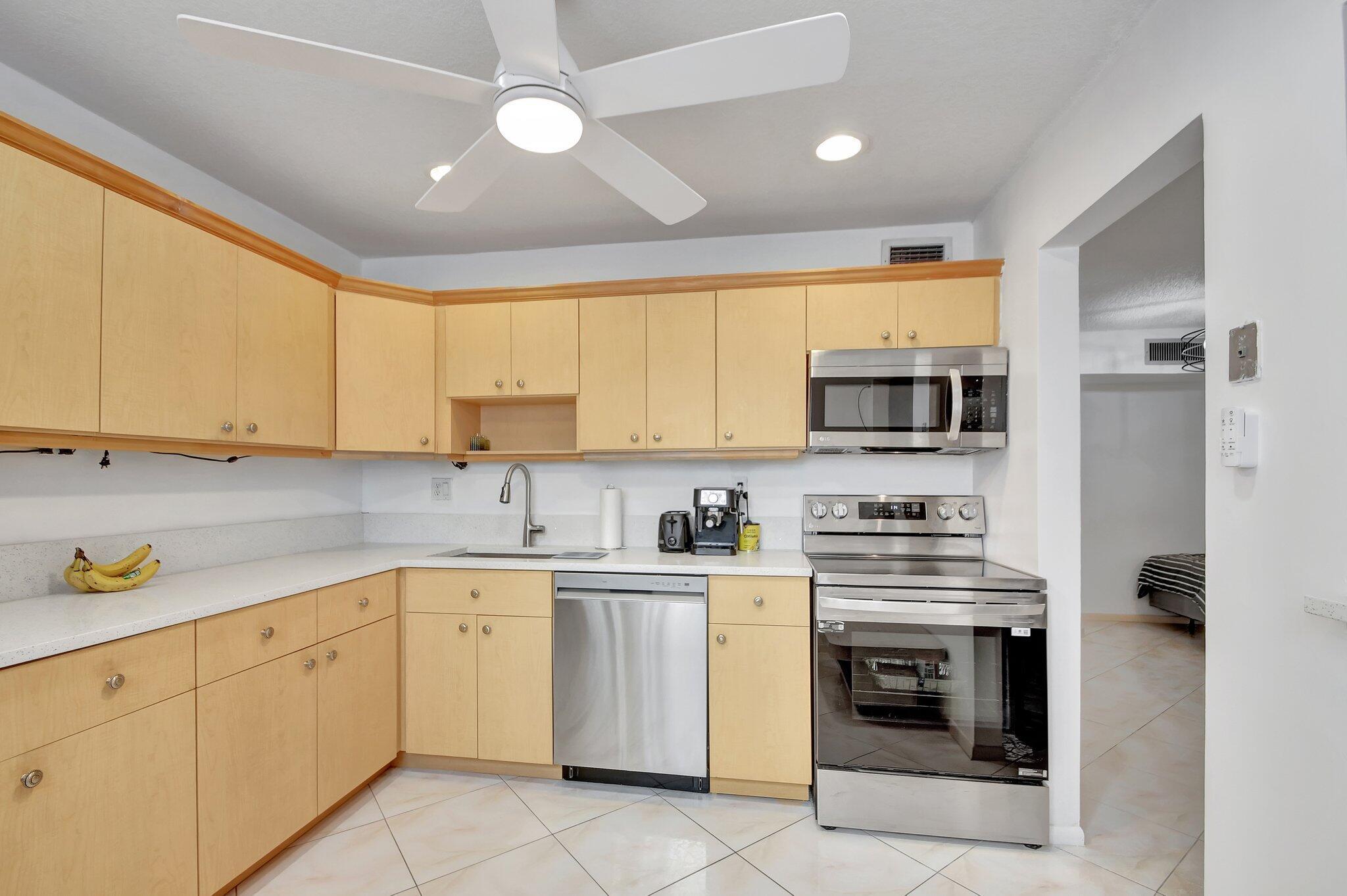 Just listed Deluxe 1 Bedroom/1.5 Bath In the Luxurious Piedmont Section of Kings Point 55+ Golf and Country Club. This CBS building has a real elevator and is surrounded by water and golf greenery. Ceramic Tile flooring throughout the living area. Large Updated kitchen boasts stainless steel appliances, updated cabinets, and quartz countertops. This condo has been freshly painted and is move-in ready! Updated quest bathroom! Oversized bedroom features walk in shower, a walk in closet and custom shelving! Oversized enclosed patio features garden view with storage closet. Kings Point offers two 18 Hole Golf Courses, indoor/outdoor pools, tennis courts, theater, Cafe and Bistro. Minutes from Downtown Delray! Beaches, and much more!! This condo is a must see!!
