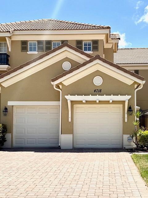 The best & largest floor plan (Madrid) built in Paloma with over 2300 SF of living space. Meticulously maintained by original owner. This townhome is in move-in condition with wonderful upgrades & an amazing lake view. Features include: NEW - A/C; Carpet on Stairs & 2nd Level; Central Vac System; Washer/Dryer; Dishwasher; Garage Freezer & Detailed Wood Moldings. Windows are all impact. The entry has a private gated area & the front door has custom upgraded leaded glass. Do not miss this opportunity to own one of the best locations & floor plans for a Paloma townhome. Furniture is negotiable, making this great townhome move-in ready.