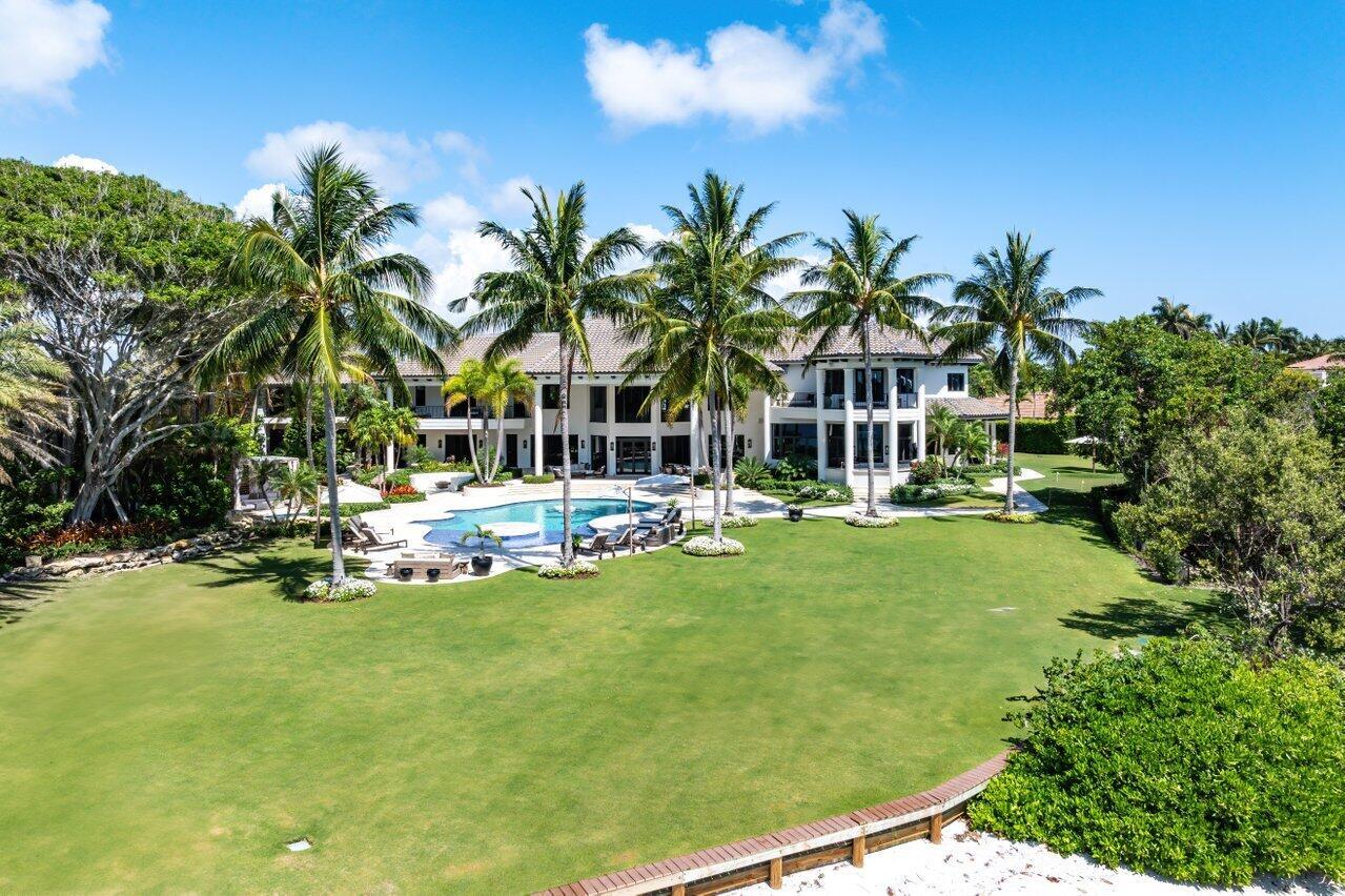Experience the waterfront dream in this completely renovated home sitting on 1.3 acres and appx 320' of direct intracoastal waterfront with unobstructed views. This 12,000 SF home truly has it all.Beautiful finishes accompany every amenity you can think of on this property. Golf Simulator room, Full gym and spa with cold plunge and exterior sauna, summer kitchen, full size putting green with sand trap, oversized pool with resort style spa, cabana, firepit area, private beach, dock on property large enough for 100'+ boat.Main House features 5 bedrooms, all with en-suite baths. 2 offices (1 off the master), golf simulator, living room with a bar and beautiful oversized kitchen leading to the family room Guest House features full gym on first floor (all equipment included), and guest quarters upstairs with full Kitchen, living room and bedroom.

Improvements during the 2024 renovation include: new roof, new impact windows and doors, new electrical, new HVAC systems and duct work, new plumbing, appliances, all new interior finishes, new stucco, upgraded and refinished pool, summer kitchen, sauna, putting green, firepit, and beach area. This is just some of the extensive work that went into this home.

This home also includes a full house generator, smart home technology and much, much more. The Home is being sold fully furnished.

The property is located in desirable Jonathan's Landing Golf Club. Club Membership is not required.

Please note, all Square footage numbers are approximate.