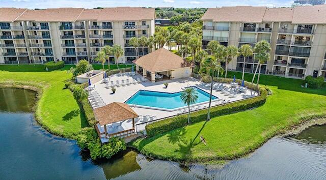 This 2/2 beautiful condo unit is located in one of best rental property Marina communities in Jupiter! The open balcony stretches from the living room to the primary bedroom with a beautiful view of the pool & marina.The condo has impact glass sliders, solid wood floors, & updated kitchen with granite countertops. The laundry room includes bonus space for multiple purposes. Marina at the Bluffs is located just a mere 0.8 miles from the ocean & a short distance to Publix Supermarket, pharmacy, restaurants, etc. The condo sports a day dock for family and friends to visit. The Community has four pools, Tennis Courts, Bocce Ball, community beach, and more.. This property is great for an annual or seasonal rental - don't miss out!!