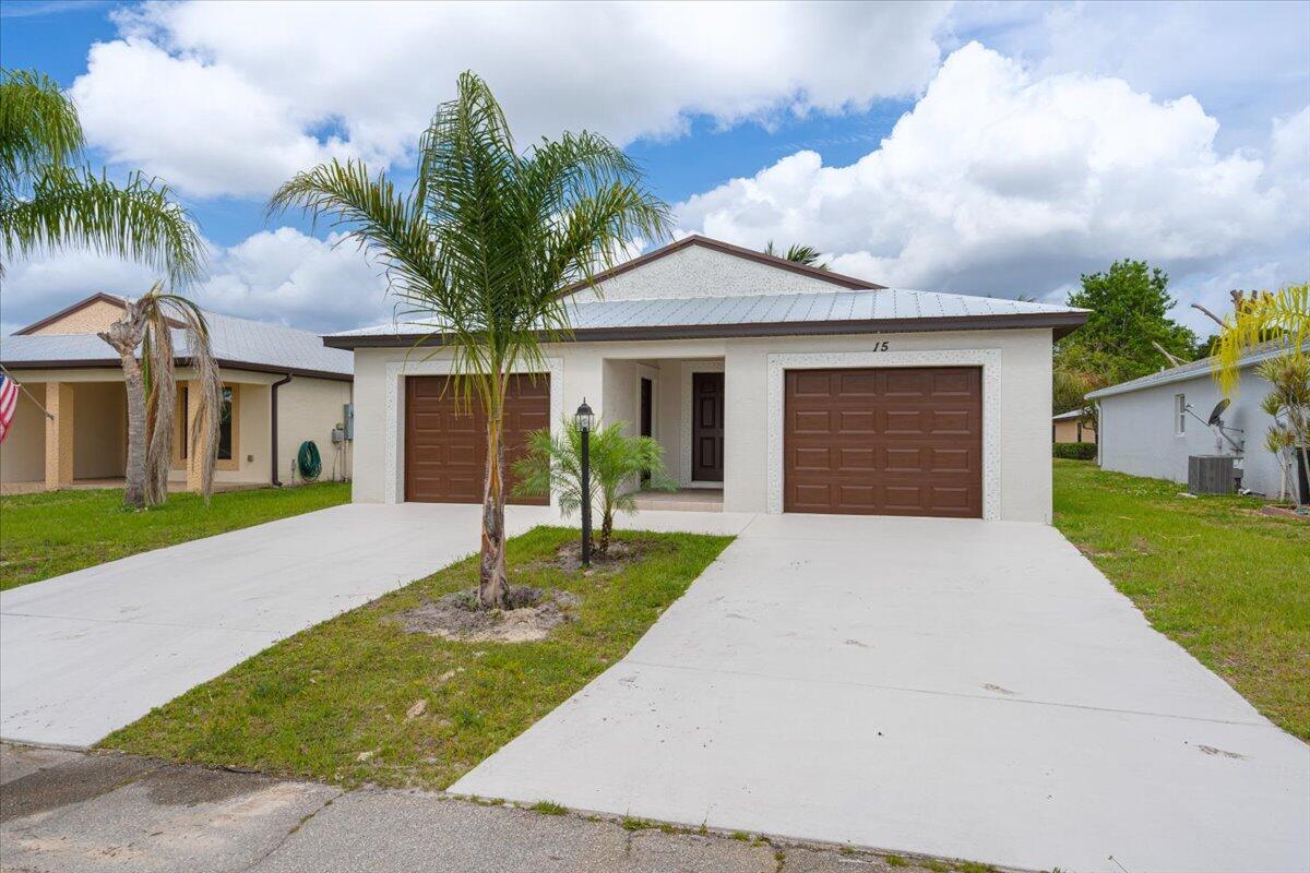 Great home at a great price, ready for a new homeowner in this 55+ community! This popular Windsor model is just 2 years old and has locked in lifetime lot rent of just $599 a month, so it will never increase as long as you own it! White shaker cabinets with granite counters, Vaulted ceilings, metal roof, Hurricane impact windows, and laminate floors in the main area. Spanish Lakes has so many amazing people and amenities that you will find the greatest friends who will become like family in no time! Private golf course ( no fees to play,) 2 pools, pickleball, tennis, shuffleboard, bocce, gym, library, cards, Mah jong, bible study, wood workshop, golf cart parades, dinners, dances, trips, and so much more! Grass cutting is also included, as is trash removal.