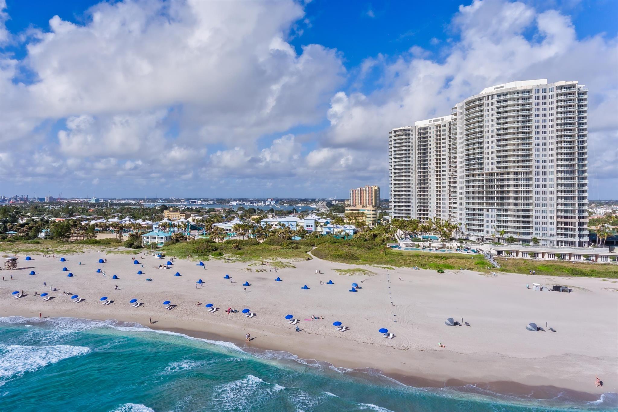 Discover an unparalleled living experience at this exquisite Ritz-Carlton residence, positioned directly on the sand. This stunning property offers two spacious bedrooms with a den and two and a half baths, perfect for both relaxation and entertaining. Benefit from world-class amenities including two sparkling pools, direct beach access, and a property-owned restaurant that meets all your culinary desires. Two covered parking spaces add convenience to your lifestyle, making it ideal for both homeowners and investors looking for a resort-like experience with investment potential. Located on the desirable Singer Island, you're a short walk away from vibrant restaurants and bars, capturing the essence of this premier tourist destination. Known for its golden shorelines and clear waters