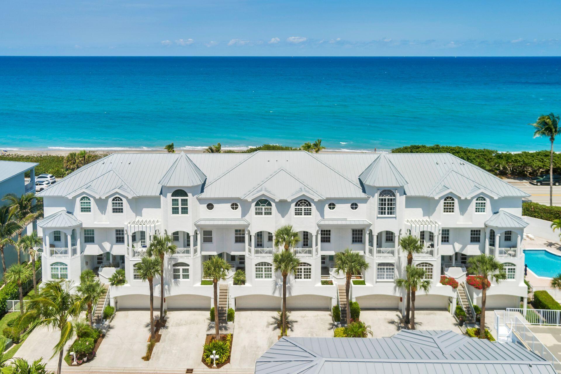 Enjoy panoramic beach and ocean views from this bright and spacious 4-bedroom, 4-bath townhouse in the exclusive, gated community of Jupiter Key. Offering over 3,200 square feet of luxurious living space, this coastal retreat combines elegance, comfort, and convenience just steps from the sand. Inside, you'll find a gourmet kitchen with rich cherry cabinetry, premium appliances, and hardwood floors throughout the main living areas. The expansive master suite features a spa-like ensuite bath and private patio access, perfect for morning coffee with an ocean breeze. Additional highlights include an in-unit elevator, double-car garage, two brand-new Trane AC units, and a fire protection sprinkler system for peace of mind. With four outdoor patios and access to a stunning beachfront