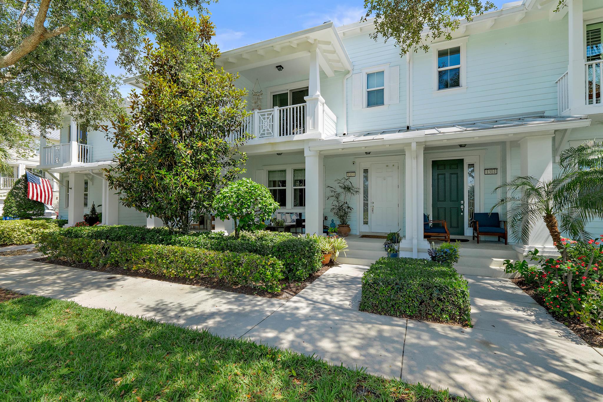 This beautifully updated townhouse is located in the highly desirable Mallory Creek at Abacoa. Enjoy peaceful lake views from the front patio and both upstairs balconies. The first floor offers durable vinyl flooring, a freshly painted interior, and a sleek kitchen with 42'' raised-panel wood cabinetry, quartz countertops with a waterfall edge, and a decorative backsplash. A standout upgrade is the modernized staircase, featuring a wood and metal cable banister for a clean, contemporary look. Upstairs, enjoy rich wood flooring and two renovated bathrooms with stunning calcite stone-topped vanities. Full impact glass provides added storm protection and quiet comfort. Additional updates include a new HVAC system (2024) and a newer hot water heater (2018). just a short walk to the clubhouse featuring a resort-style pool, fitness center, and billiards room. All in a prime Jupiter location close to downtown Abacoa offering shops, dining, Roger Dean Stadium, and Lighthouse Cove Adventure Golf!