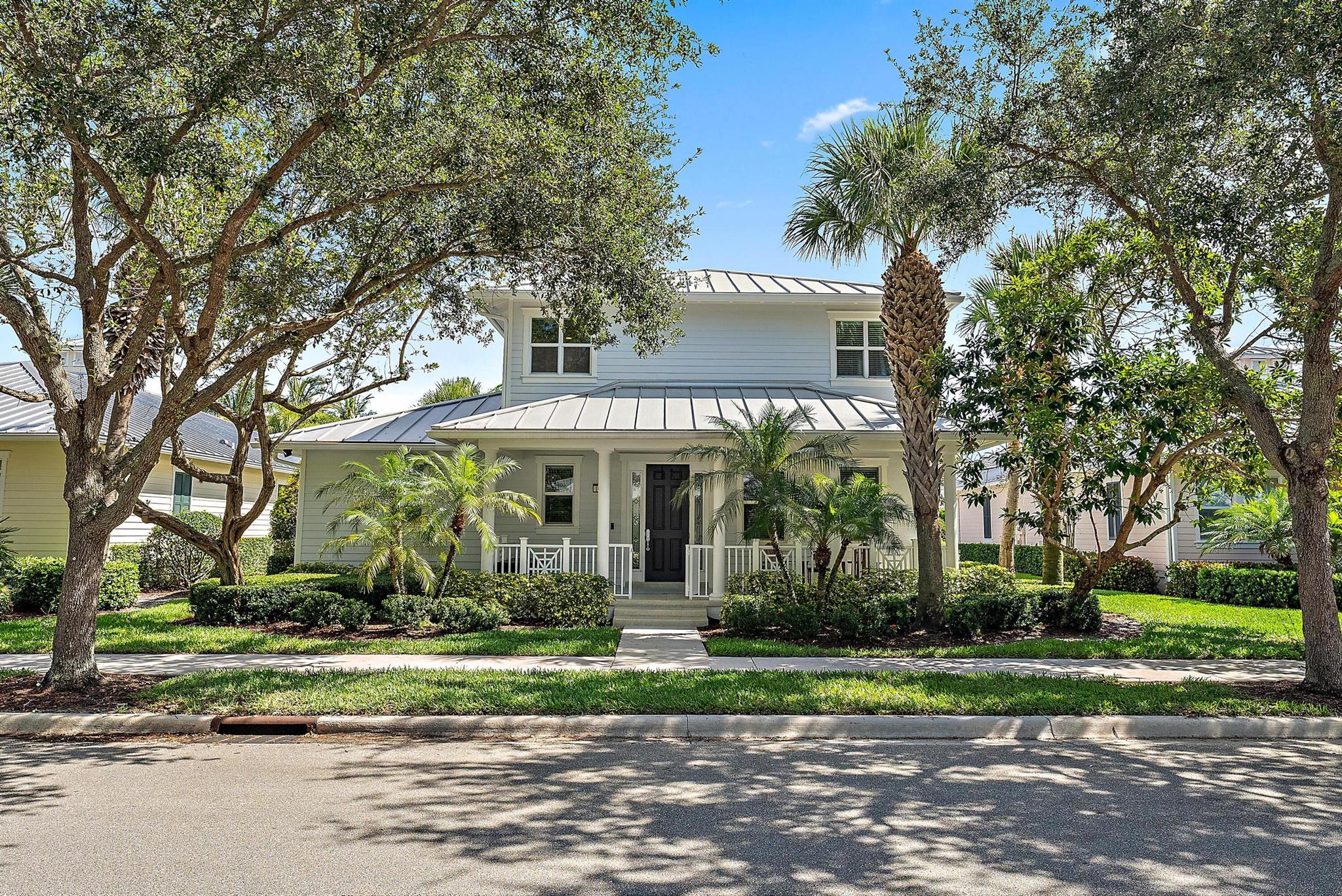 This beautifully landscaped home is an ABSOLUTE GEM nestled in a tranquil corner of the highly sought-after Mallory Creek community within Abacoa. The rarely available DiVosta Mistral Floor plan offers 4 bedrooms and 3 1/2 bathrooms. An open downstairs living area with impressive high ceilings as well as a desirable 1st floor master suite with its stunning spa-like master bathroom both overlook a sparkling backyard oasis with heated saltwater pool and new travertine decking. The modern, updated kitchen, laundry, and all bathrooms boast lovely new quartz countertops. Additional upgrades include impact windows, motorized outdoor patio screen and interior shades, tankless water heater, water softener system, new built-in closet shelving - there are so many impressive features to enjoy!