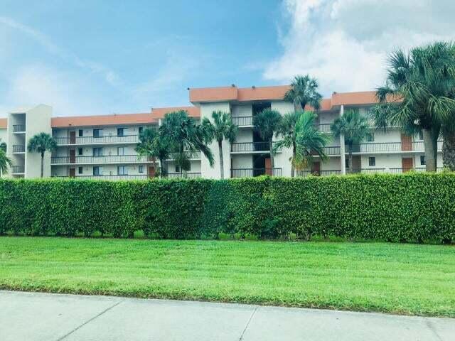 IF LOOKING FOR A SPACIOUS BUT WELL PRICED 2/2 CONDO ON THE FIRST FLOOR WITH YOUR PARKING SPOT OUTSIDE YOUR FRONT DOOR, CHECK OUT THIS UNIT IN OLYMPUS VILLAGE. FEATURES INCLUDE NEW CARPET 2025 IN LIVING ROOM AND BEDROOMS, ROOF 2021, AC 2020, WATER HEATER 2018, DISHWASHER 2017. ENJOY TILE IN KITCHEN, DINING, ENTRANCE AND BATHROOMS. INTERIOR WALLS JUST PAINTED! LOVE THE SPLIT BEDROOM FLOORPLAN. MASTER HAS GOOD SIZE WALK IN CLOSET PLUS AN UPGRADED SHOWER. THERE ARE 3 ROOMS LEADING TO YOUR PORCH,''MASTER, LIVING ROOM AND KITCHEN'' YOUR LARGE SCREENED IN PORCH WITH PULL DOWN SHUTTERS AND STORAGE AREA OPENS UP TO A ''MASSIVE BACK LAWN! YOUR JUST STEPS AWAY FROM THE INVITING POOL!! LANTANA 'S SMALL AIRPORT IS ACROSS THE STREET, PUBLIX, GREAT RESTAURANTS, SHOPS OF ALL KINDS & OCEAN JUST MINUTES AW