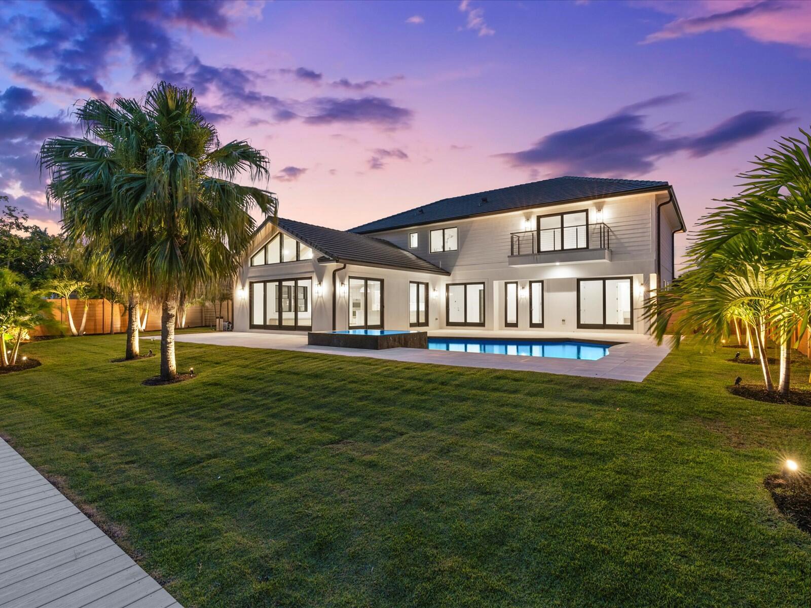 Imagine waking up every day at 8 Leeward Circle, a modern waterfront masterpiece in the heart of Tequesta.You'll enjoy 60 feet of waterfront, a 34-foot dock with ocean access just one fixed bridge away and a home that was completed with no expense spared. 5 bedrooms, 6 bathrooms, over 3,800 square feet of living space, every inch filled with carefully curated designer selections, from the marble countertops and hidden walk-in pantry in your chef's kitchen to the luxury primary suite with a massive walk-in closet and its own private balcony.Step outside to your heated saltwater pool and spa, expansive marble patio and dock ready with water and electric hookup, everything set for endless days on the water.You're just a short golf cart ride from the Tequesta Country Club and Turtle Creek Club, close to the best restaurants, A-rated schools, shops, parks, beaches and so much more.

If living in luxury on the water has ever been something you dreamed of this could very well be the one.