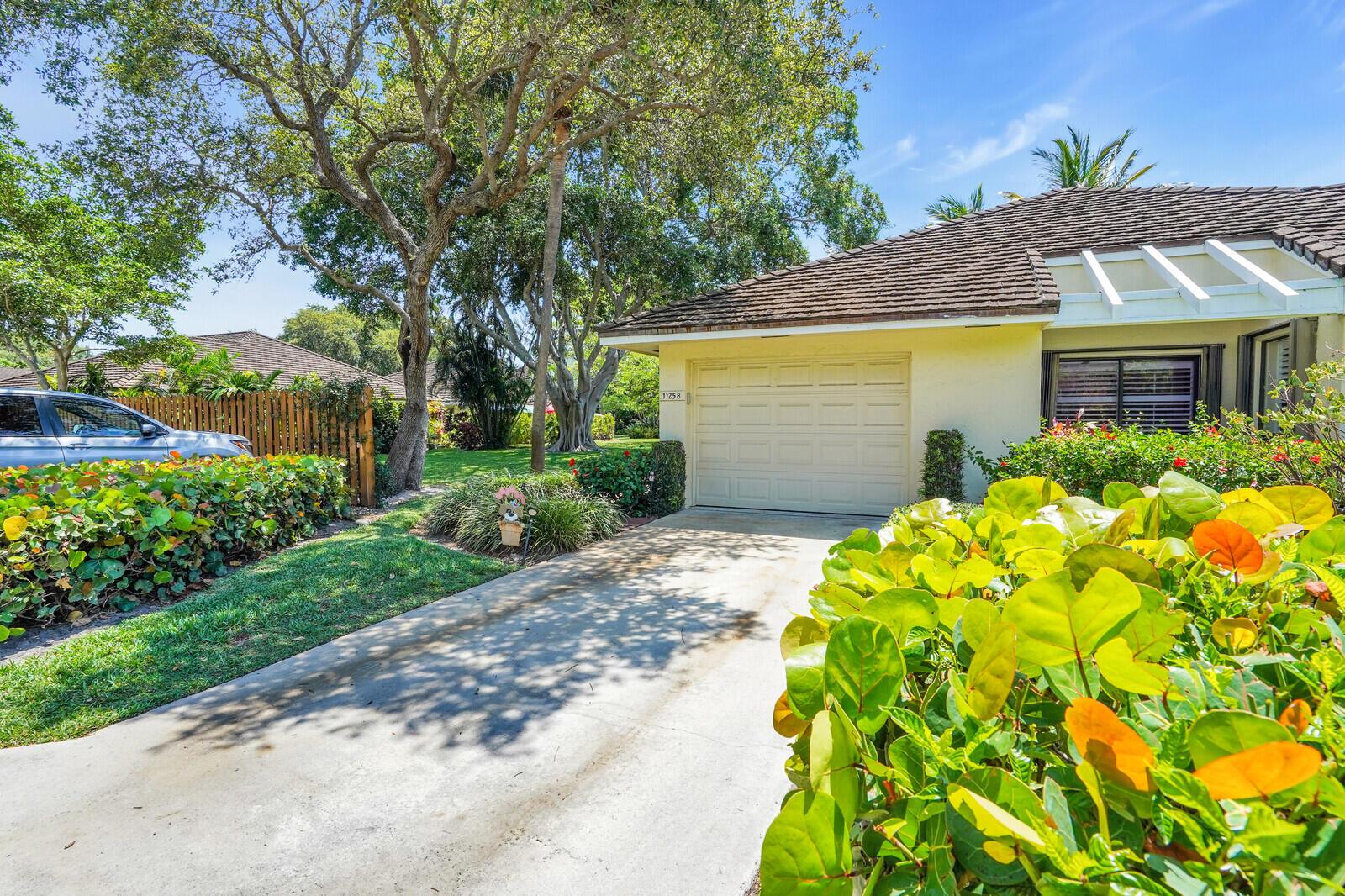 MAINTENANCE FEE COVERS ROOF REPLACEMENT COST 100%, HVAC 2023, WATER HEATER 2020 Welcome to Twelve Oaks, one of North Palm Beach's most sought-after gated waterfront communities. This beautiful 3BR/2BA villa offers resort-style living w/ direct unobstructed ocean access. Located in an all-age, pet-friendly neighborhood, the home blends luxury upgrades with effortless coastal charm including FULL ACCORDION SHUTTERS.Enjoy a newly renovated kitchen featuring high-end cabinetry, granite countertops, Samsung stainless steel appliances, stainless steel range hood, beautiful mosaic back splash and glass-front display cabinets. Indulge in the convenience of a private coffee bar featuring a stylish copper sink. Plantation shutters and abundant natural light enhance the open inviting layout. Relax on your private screened-in lanai with Mexican tile flooring, perfect for quiet mornings or evening gatherings. Additional features include LG front-loading washer/dryer. Ample guest parking is conveniently located adjacent to the residence, while the expansive green space next door offers a tranquil setting ideal for relaxation and pet owners alike.
HOA covers roof replacement at no additional cost to the homeowner, offering both financial benefit and peace of mind. Additional covered services and community amenities include 4 pools, tennis courts, pickle ball, clubhouse, cable, exterior painting of unit, lawn maintenance, and 24-hour manned security.
Boat dockage is available for owners to rent or purchase in the private deep-water marina, which features 65 slips accommodating vessels up to 50 feet and offers easy access to the Intracoastal waterways and the Palm Beach Inlet.
Twelve Oaks is conveniently situated near the intersection of PGA Boulevard and U.S. Highway 1. Its prime location offers easy access to local attractions such as the Gardens Mall, North Palm Beach Country Club, MacArthur State Beach Park, and the beaches of Singer Island and Juno Beach. 
Don't miss this opportunity to own a gorgeous villa in one of North Palm Beach's finest boating communities!