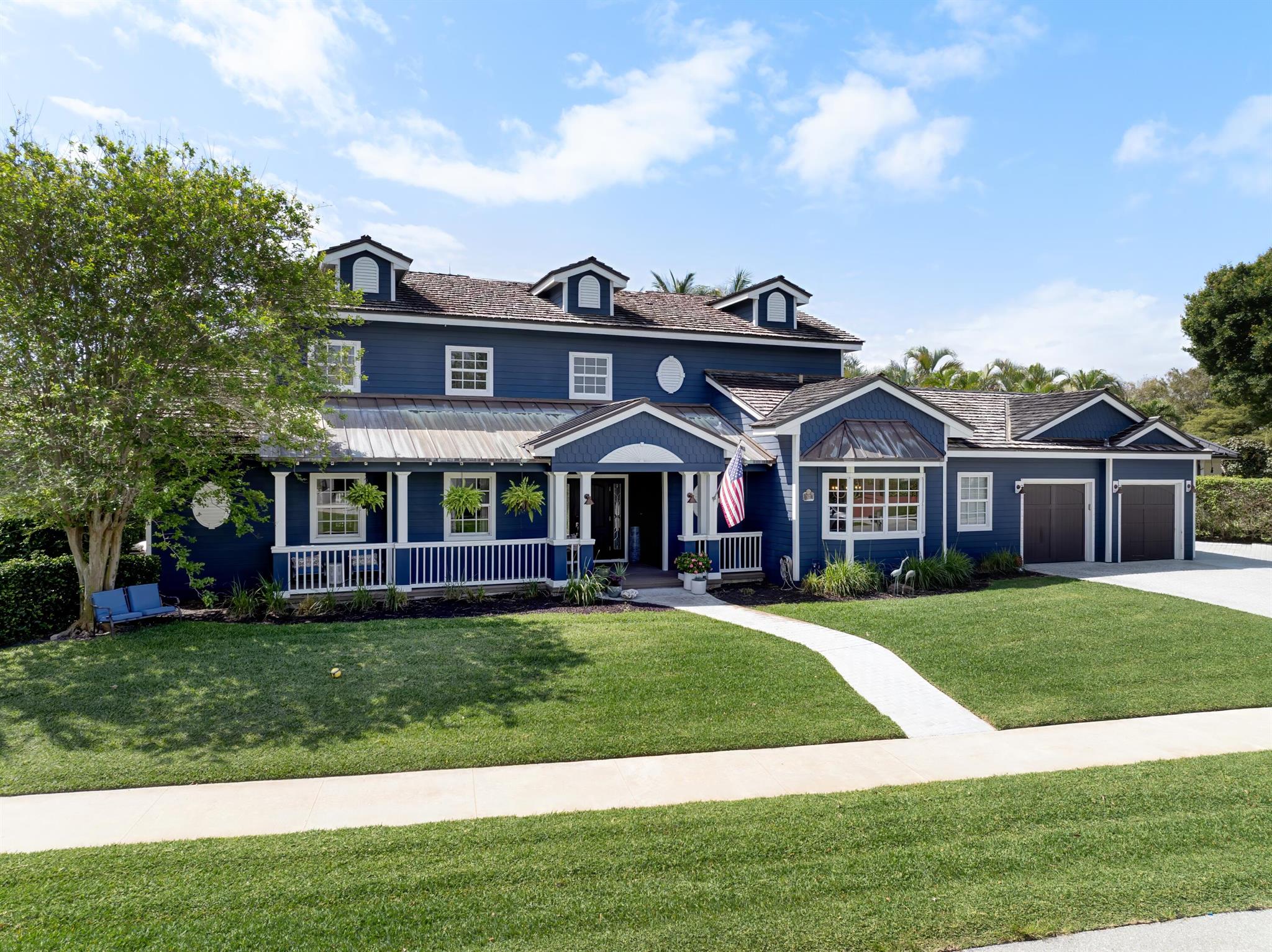 Owner financing available! A stunning Nantucket Coastal 5-bedroom, 4-bath estate situated on a prime corner lot .37 Acres (172 x 151 x 39 x 202) with 39 feet of direct Intracoastal frontage and no fixed bridges to the ocean! This spacious residence offers over 4,571 total square feet (3,466 under air) of coastal elegance and modern upgrades, making it perfect for year-round living or a seasonal retreat. Step inside to vaulted ceilings in the living room and 30x30 wood-look porcelain tile throughout the entire first floor. The expansive great room features a cozy wood-burning fireplace and flows seamlessly to the sparkling 35' x 18' sports pool, ideal for entertaining. The eat-in kitchen is complete with granite countertops, a new refrigerator, cooktop stove, wall oven, a breakfast nook, full tile backsplash, and bar seating. A spacious dining area boasts designer tile work and chandelier lighting, while a chic "Martini Room" overlooks the pool and canal for stylish lounging.
Enjoy a split bedroom layout with a first-floor oversized guest suite. An ensuite bath with floor-to-ceiling Italian tile and an overside walk-in closet. Upstairs, find three additional bedrooms, including a loft area, guest rooms with canal and pool views, and a beautifully updated full bath with dual sinks and custom tile.
The first floor primary suite features a private sitting area with pocket doors, his and hers closets, private patio access (with built-in dog door), and a spa-style bath with jetted tub, skylights, and granite countertops.
Outside, enjoy the Florida lifestyle with a covered lanai with tongue &amp; groove pine ceiling, paver decking, and additional private seating area by the water. A 14,000 lb hi-tide lift, and a seawall with new concrete cap and batter pilings. Additional highlights include a 2-car garage, oversized paver driveway, shutters (1st floor) + impact windows (2nd floor), 2 A/C units and newer water heater. This home truly has it all&#x14;boater's paradise, entertainer's dream, and comfortable family living all in one.
The Village of North Palm Beach is becoming one of the most sought-after communities in Northern Palm Beach County. It is a coastal community with easy access to both the Palm Beach and the Jupiter inlets for some of the best fishing in the world. Combined with easy access to Palm Beach International Airport, some of the best beaches and a wide range of dining establishments in the area, the village is becoming one of the top communities in Northern Palm Beach County. The Village is also home of the newly renovated North Palm Beach Country Club, featuring an Olympic swimming pool, splash pad, picnic area, an on-deck tiki hut, 200 seat banquet room, 100 seat The Grill and The Clubhouse restaurant, A Jack Nicklaus Signature Golf Course, and a full featured Tennis Facility with Har-Tru courts. It is open to the public and village residents. The village was recently designated as a golf cart friendly community.