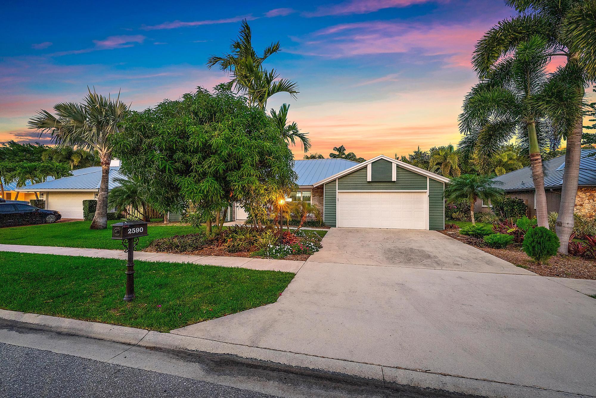 Experience luxury living in this stunning 3-bedroom, 2-bath pool home located in the highly sought-after gated community of Frenchmen's Landing. Thoughtfully designed for entertaining, this spacious home features three sets of sliding doors that open to a private backyard oasis--complete with a large covered patio, built-in grill, renovated cabana powder room, outdoor shower, and even a putting green nestled among mango, avocado, and banana trees.features include, soaring natural wood ceilings, Interior / Exterior freshly painted, a brand-new metal roof (2024), newer central A/C system (2021). Ideally located, Frenchmen's Landing is just 5 minutes to the beach and Gardens Mall, 15 minutes to Palm Beach International Airport, and minutes from shopping, dining from Jupiter to Palm Be