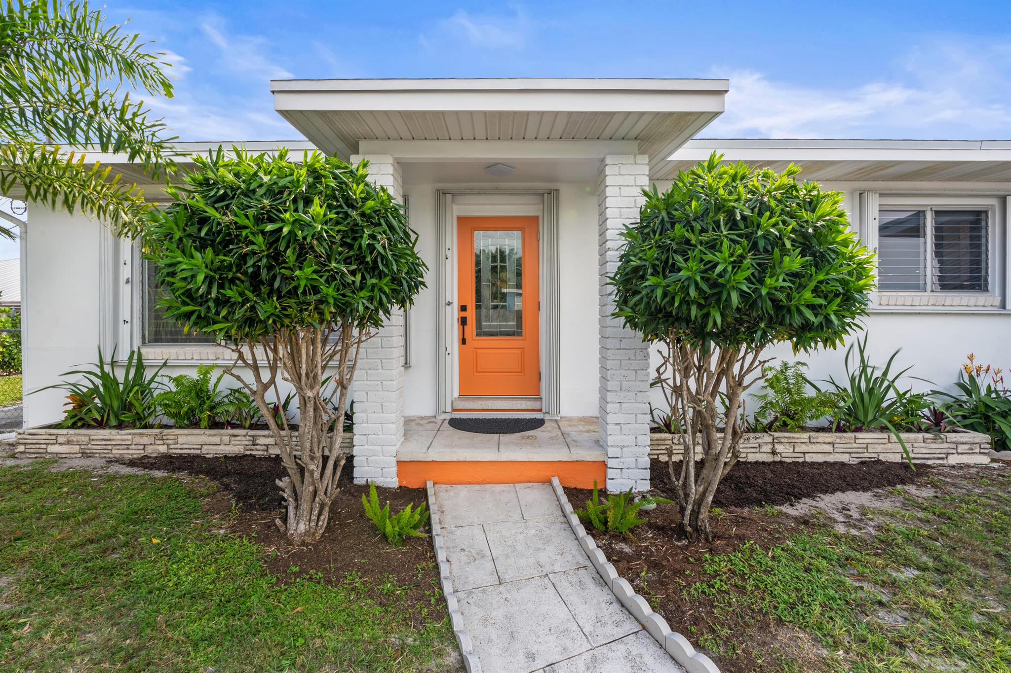 Move-In Ready Home Minutes from the Beach & Downtown Lake Worth - Prime Investment Opportunity!Welcome to 1428 N M Street in vibrant Lake Worth Beach! This beautifully renovated 3-bedroom, 2-bathroom home offers 1,410 sq ft of modern living space--fully move-in ready and ideally located just minutes from the beach, downtown's main entertainment hub, and the heart of the Lake Worth Historic District.Step inside to discover a light-filled, open-concept layout featuring an oversized quartz kitchen island that seats six--perfect for hosting or relaxing at home. The kitchen is a chef's dream with brand-new stainless steel appliances, soft-close wood cabinetry, designer lighting, and a charming built-in coffee bar.The spacious primary suite offers a peaceful retreat with an en-suit bath and ample closet space. Two additional bedrooms provide flexibility for guests, family, or a home office, while the fully updated guest bathroom features a stylish tub/shower combo.
Enjoy the best of indoor-outdoor living with a large screened-in patio and private, fenced backyard&#x14;ideal for entertaining, gardening, or simply soaking up the Florida sunshine.
Additional highlights include:
    "    Carport
    "    Full hurricane protection (impact doors + accordion shutters)
    "    Thoughtful updates and abundant storage throughout
Location is everything, and this property delivers:
    "    Less than 5 minutes to Lake Worth Beach
    "    Walk or bike to downtown shops, dining, and nightlife
    "    Steps from year-round festivals, live music, and art shows
    "    Easy access to Palm Beach International Airport and West Palm Beach
Whether you're looking for a full-time residence, a seasonal escape, or a high-demand investment property, this home puts you in the heart of it all. Don't miss this rare opportunity to own in one of South Florida's most dynamic and walkable coastal communities.
Schedule your showing today&#x14;your Lake Worth Beach lifestyle awaits!