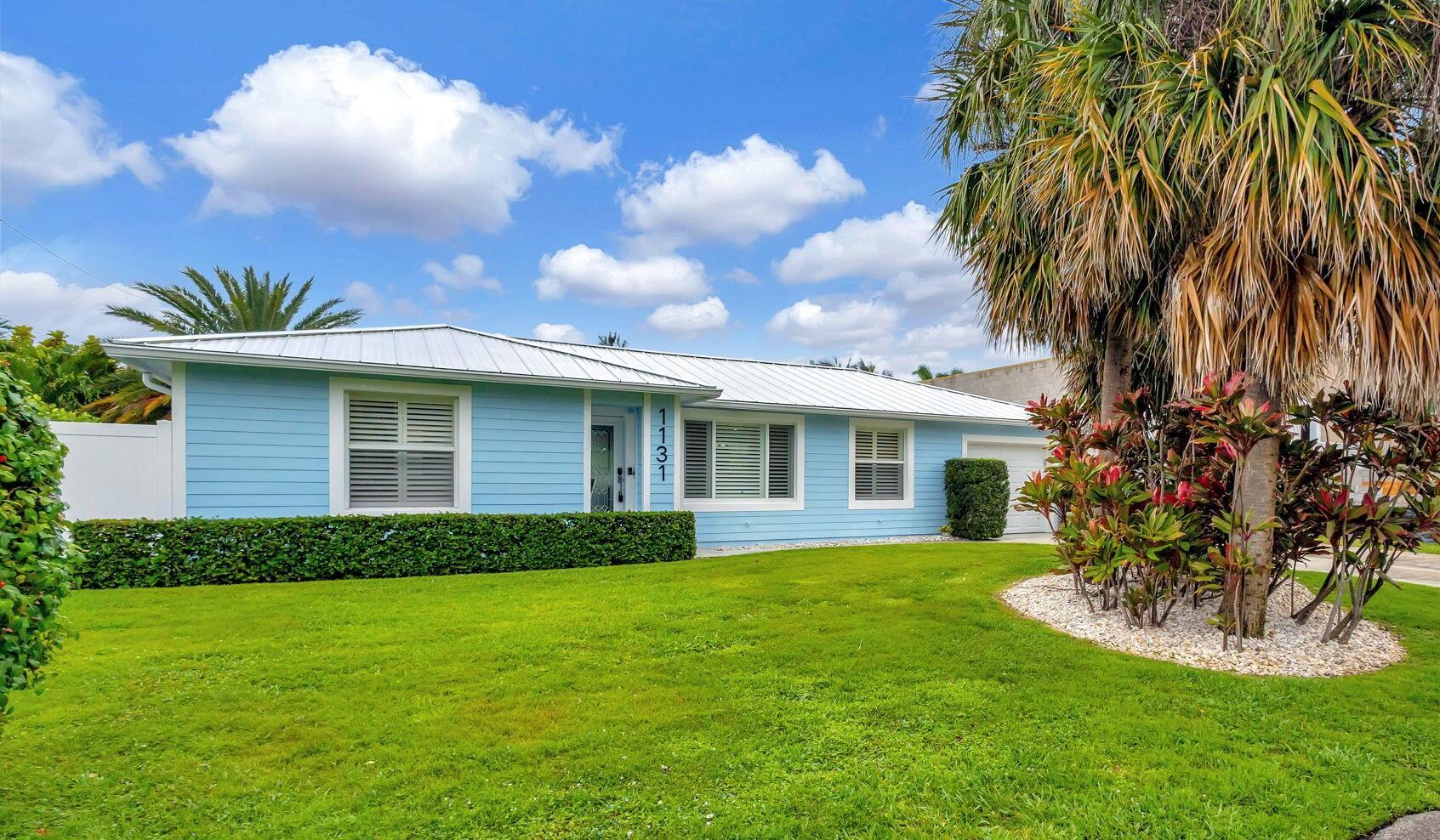 Move right into this impeccable, recently renovated, Yacht Harbor Estates home that includes a beautiful modern custom pool with a travertine deck and new pool heater. The backyard is a south facing, private, fenced retreat that along with the new heated pool, has a covered patio and lots of open area.  Other new features include an a/c system with an ultra-violet light, travertine tile throughout, impact windows and plantation shutters. Front to back, the home is street to street with no immediate rear neighbors, has 2 bedrooms / 2 baths with an additional flex area currently used as a sleeping/exercise room and a wide driveway, and a garage.  Furniture is negotiable. Close to PBI airport,  beaches, intracoastal, Singer Island and Palm Beach County venues, amenities, and hotels.