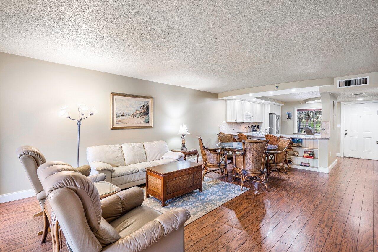 Your Dream Summer or Winter Getaway in Jupiter Bay! Looking for the perfect coastal escape? This stunning 2BR/2BA condo at Jupiter Bay Resort has it all--starting with a beautiful open kitchen featuring sleek granite countertops and warm wood floors throughout (no carpet here!). Fully furnished with a spacious king primary suite and twin guest bedroom, it's ideal for families, snowbirds, or weekend getaways with friends. Whether you're chasing sunshine in the winter or planning the ultimate summer stay, you'll love being just a short walk to the beach, shopping, and dining. This one's turnkey and ready--are you?