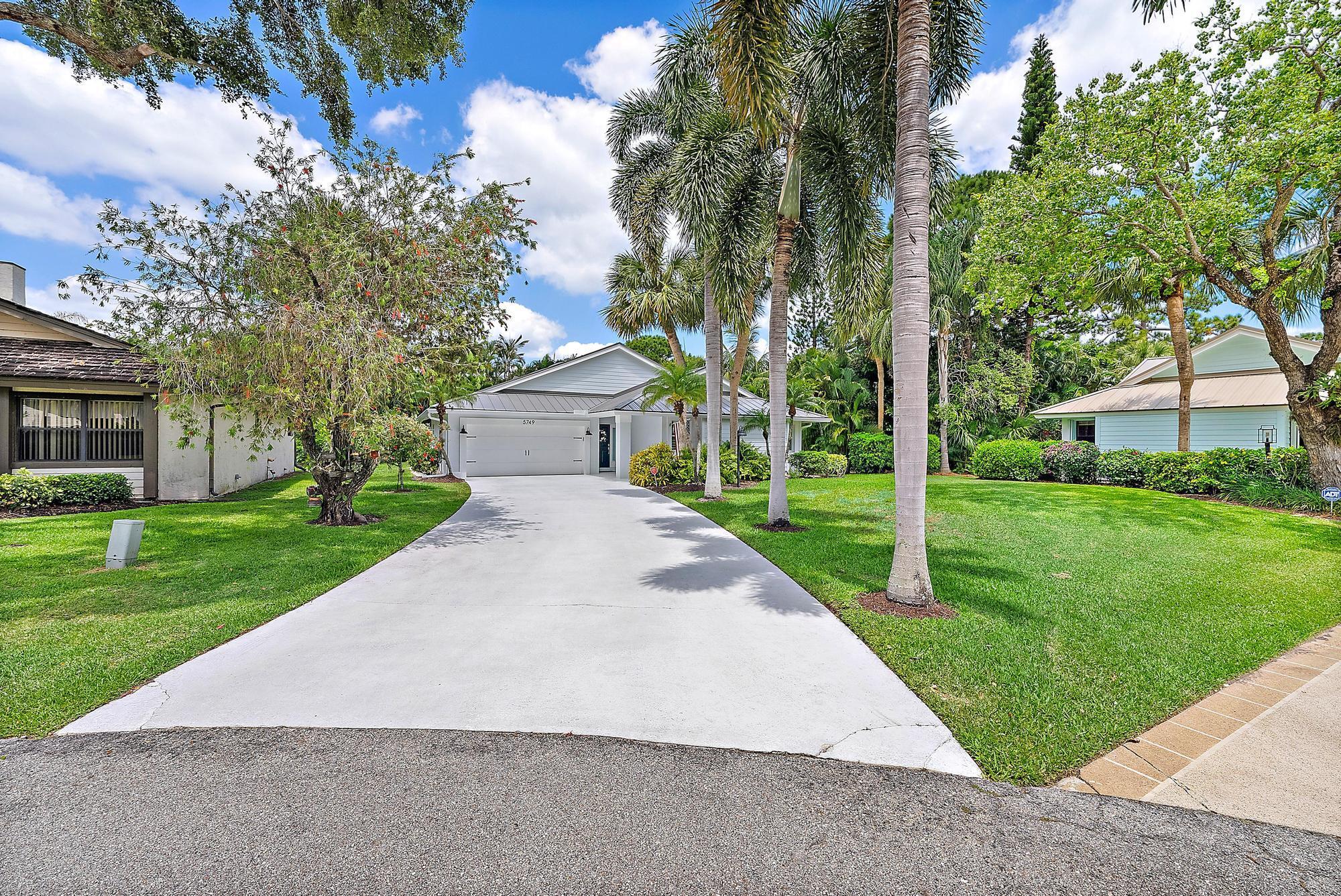 Come see this 3 bedroom, 2 bath CBS home located on a quiet cul-de-sac in Jupiter, Florida. This home has been meticulously maintained with a seamless metal roof in 2022, new PGT hurricane impact windows & sliding glass doors in 2022, hurricane impact rated garage door and new garage door opener in 2025, new GE washer and dryer in 2024, and new frameless shower door. Other notable upgrades include: exterior concrete Hardie Board siding, new fascia trim and exterior paint in 2022. A/C was replaced in 2021 and Rheem water heater was replaced in 2018. The beautiful kitchen was remodeled in 2021 with granite countertops, soft-close wood cabinetry and stainless-steel GE appliances. The hurricane impact glass sliding doors off the master bedroom and living room lead out to your spacious and ver y private screened in patio which is a wonderful space to entertain and enjoy the South Florida lifestyle. Woodland Estates is a small, well-maintained HOA community consisting of 94 single family homes in the heart of Jupiter and features a community swimming pool and tennis courts. This home is located super close to amazing Jupiter beaches, restaurants, and only 25 minutes from Palm Beach International Airport. Zoned for "A" rated Jupiter schools.