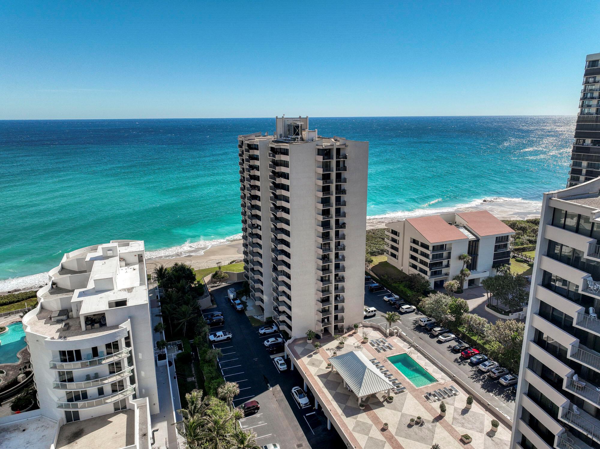 Spectacular Intracoastal and Ocean Views! This bright and spacious 2-bed, 2-bath corner unit in Cote D'Azur offers sunrise and sunset vistas from two private balconies. The open living and dining area features neutral tile flooring, while the galley kitchen includes a waterfront breakfast nook. The primary suite boasts an oversized walk-in closet, glass sliders to the balcony, and a renovated en-suite with Jacuzzi tub and walk-in shower. Community amenities include private beach access, heated pool, tennis courts, fitness center, sauna, and covered parking -- all in a well-maintained, friendly community.A/C 2024 & Water heater 2020.