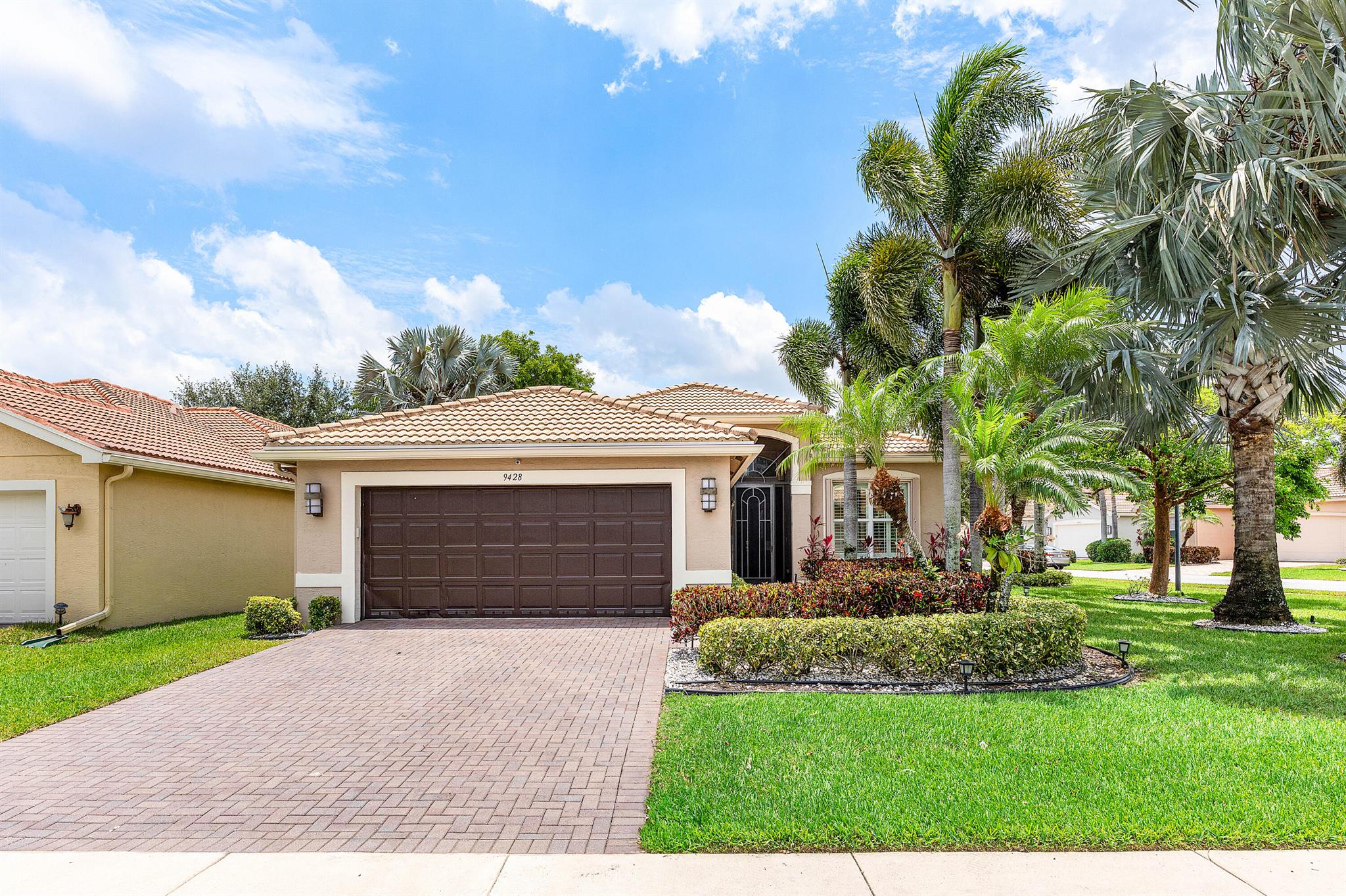 This beautifully appointed Isabelle model (2/2+den) sits on an oversized corner lot backing south. The home features lush landscaping with landscape lighting, accordion hurricane shutters, screened portico at entry, tile in main living areas, 'wood look' floors in bedrooms, crown moldings, plantation shutters, designer light fixtures, fans, built-in closets, upgraded baths with commode/bidets & more! The gourmet kitchen has white wood cabinets, quartz countertops with full height backsplash, counter height island/snack bar with beautiful pendant lights, stainless steel appliances, two built-in pantry cabinets and all the bells & whistles! Large master suite with luxurious bath. You'll love the covered extended patio, birdcage with picture frame screen & lushly landscaped oversized yard. Valencia Reserve is a premier 55+ lifestyle community with a full-time Lifestyle Director. The community offers activities, trips, shows and clubs of all types. The 14 acre waterfront recreation center includes a 41,000 square feet clubhouse which is currently under renovation with an expected reopening date of December 2025. There are "tents" erected outside with some "indoor" activities taking place. The outdoor activities are open. They include three pools - a beautiful resort style pool, resistance pool, swimmer's pool with lap lanes - and a whirlpool spa, nine har-tru tennis courts with shade pavilions and lighting for night play, tennis pro shop and league play, pickleball courts and league play, walking/jogging/biking paths throughout the community and a basketball court. The clubhouse features an expansive foyer and lobby, grand ballroom with raised stage and dance floor, catering kitchen/cooking studio, arts and crafts center, four card rooms, internet/billiards room, fully equipped fitness center, two aerobics studios, men's and women's locker rooms with steam rooms and massage room, indoor/outdoor caf+¬ and more!  Valencia Reserve is conveniently located near shopping, restaurants, hospitals, houses of worship and major highways!