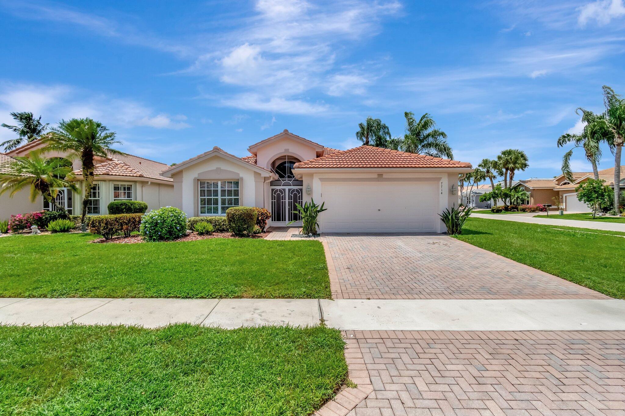 NEW ROOF 2021Incorporated into the architecturally charming Valencia Lakes community in Boynton Beach, this impressive residence located at 7714 Las Cruces Ct harmoniously merges contemporary design with comfortable living. Designed with meticulous precision, this property asserts a refined lifestyle in a resort-style environment.Upon entering this elegant home, you're greeted by an expansive great room that seamlessly connects to the dining room - an attribute that caters to both social gatherings and quiet evenings. Following this, the gourmet eat-in kitchen stands as a testament to a detailed approach to design. Equipped with quartz countertops, custom wood cabinetry, and tastefully chosen, designer tile backsplash, it serves as a masterpiece within the bounds of the property Making a perfect sanctuary, the primary suite boasts beneficial features such as tray ceilings and dual walk-in closets. Such exceptional details enhance the sense of having an individual retreat within your household. The dwelling is complemented by a glass-enclosed, air-conditioned Florida room that adds charm to the structure.

Beyond the walls of this property, the Valencia Lakes community amplifies its desirability. Its strategic positioning situates it close to Boynton Beach's popular shopping, dining experiences, and recreational activities. Exceptional community amenities include a clubhouse ideal for social events, a well-equipped fitness studio to support wellness, outdoor sports courts to appeal to sports enthusiasts, and a relaxing spa for peaceful retreats. An on-site manager further extends ease of living, ensuring the day-to-day community functions are well managed with utmost precision and care.

Welcome to a community where graceful living is paired with modern amenities. Welcome to 7714 Las Cruces Ct. Immerse yourself in a living experience that aligns with your lifestyle and aspirations. The door to your future home awaits your arrival.