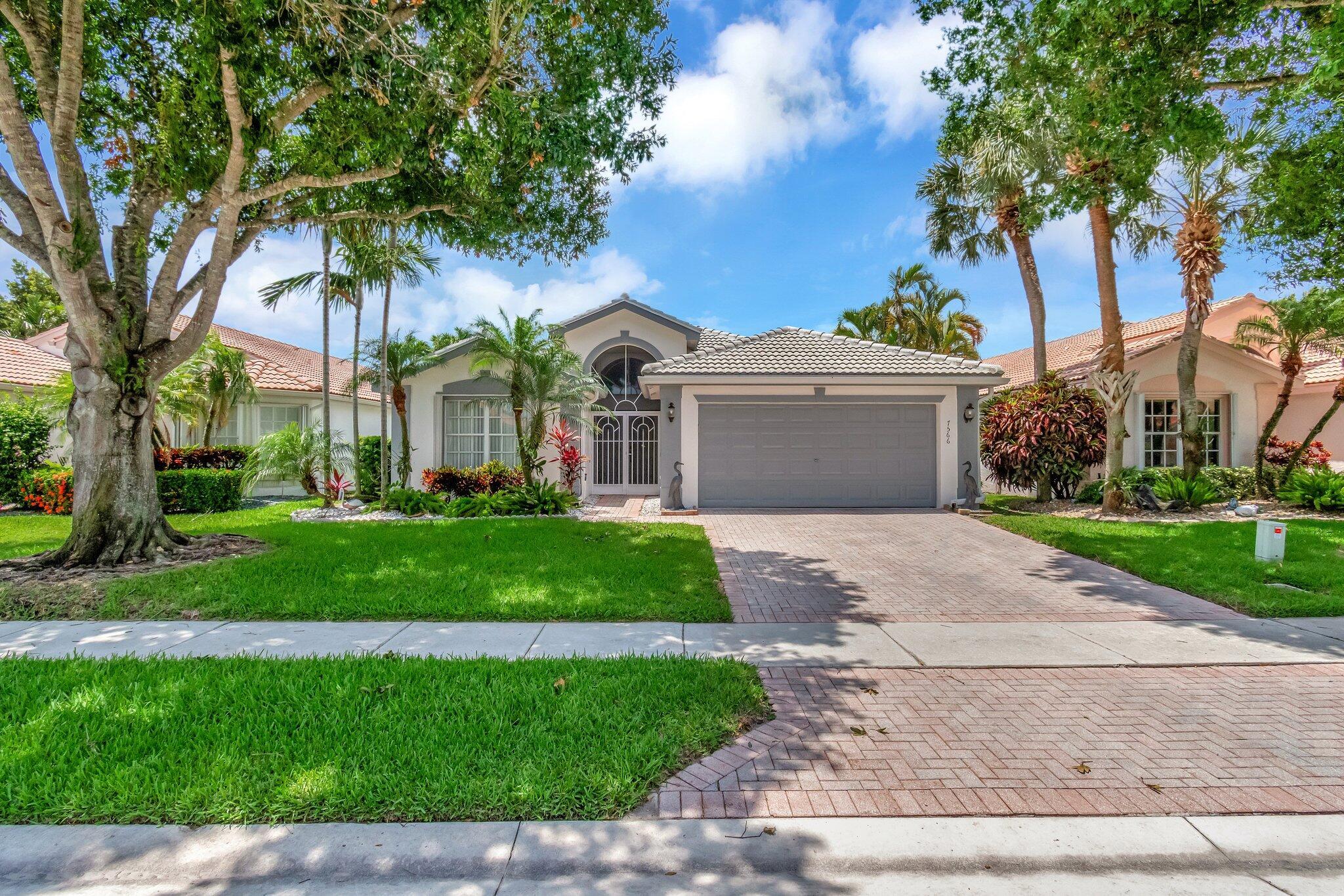 For your consideration, the prominent property at 7566 San Pedro Street, situated in the enviable neighborhood of Valencia Lakes in Boynton Beach. This one is a must-see! Professionally custom decorated with a redone gourmet kitchen, featuring quartz counter tops and shaker cabinetry. It has space for a large table in a breakfast nook with a bay window. Both bathrooms have been remodeled with laminate flooring. All 3 bedrooms have laminate as well.The living area shows a stunning wall mural painted and signed by graphic artist Peter Loerop.It is priced to sell quickly. Don't miss this fabulous buy!Ooops, almost forgot to mention the new roof (2022) and newly renovated clubhouse with a cafe. Further into the living quarters, one discovers the primary suite, a tribute to tranquility and elegance. A sculpted tray ceiling and dual walk-in closets define this bedroom, leading to an impressive bathing area. This bathroom echoes the same high-end finishes as the kitchen, boasting granite countertops and custom wood cabinetry. The centerpiece, a luxurious walk-in shower, invites a spa-like experience encouraging solitude and relaxation.

Moving outside, one encounters a screened covered patio, providing a private spot for outdoor entertainment or personal sanctuary. To enhance safety, accordion shutters have been installed, offering an additional layer of security.

Positioned ideally in Valencia Lakes, this living space benefits from various nearby amenities. The renowned Boynton Beach shopping centers, dining options, and recreational facilities are a convenient distance away. Additionally, the community houses its own retreats and recreational gateways. A guiding force within this amiable community is the on-site manager, dedicated to ensuring a harmonious and hassle-free living experience. Additional features within Valencia Lakes include a fellowship-rich clubhouse, a cutting-edge fitness studio, engaging pickleball and tennis courts, and a relaxing spa locale.

Living at 7566 San Pedro Street offers a unique opportunity to enjoy resort-style amenities within an arm's reach, nestled within a home that personifies comfort and sophistication.