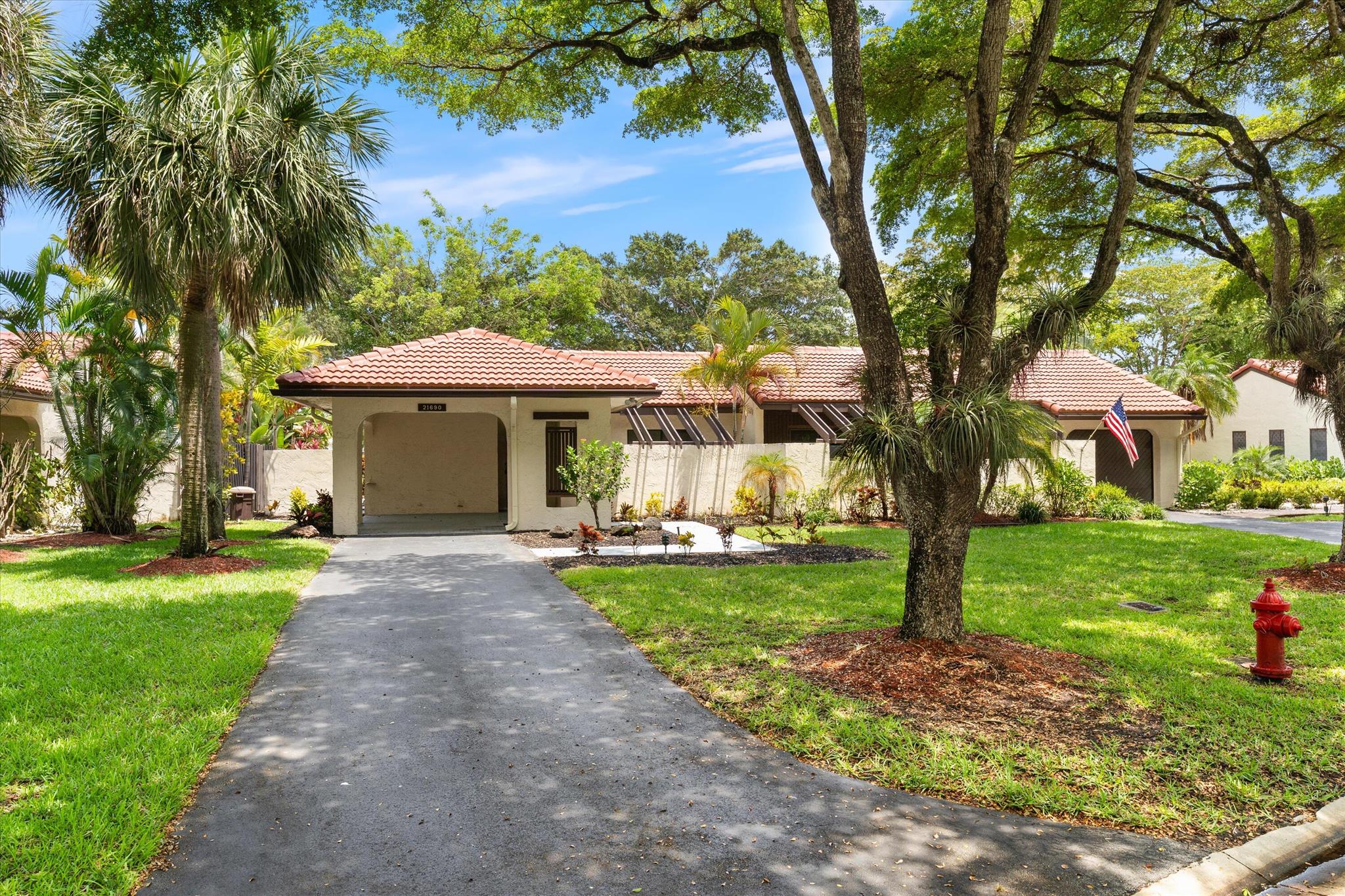 Recently updated and remodeled villa on the lake in Boca Lago.  Come see one of the best views in the community!  Delightfully decorated the highlight of this home is the massive enclosed patio with LED lighting in the ceiling overlooking the golf course, lake and footbridge.  The roof was replaced in 2022 followed by adding new kitchen with stainless appliances, full porcelain tile throughout, ship lack accents, new bathrooms, new lighting, and so much more.  This home is sure to please even the most picky buyer.