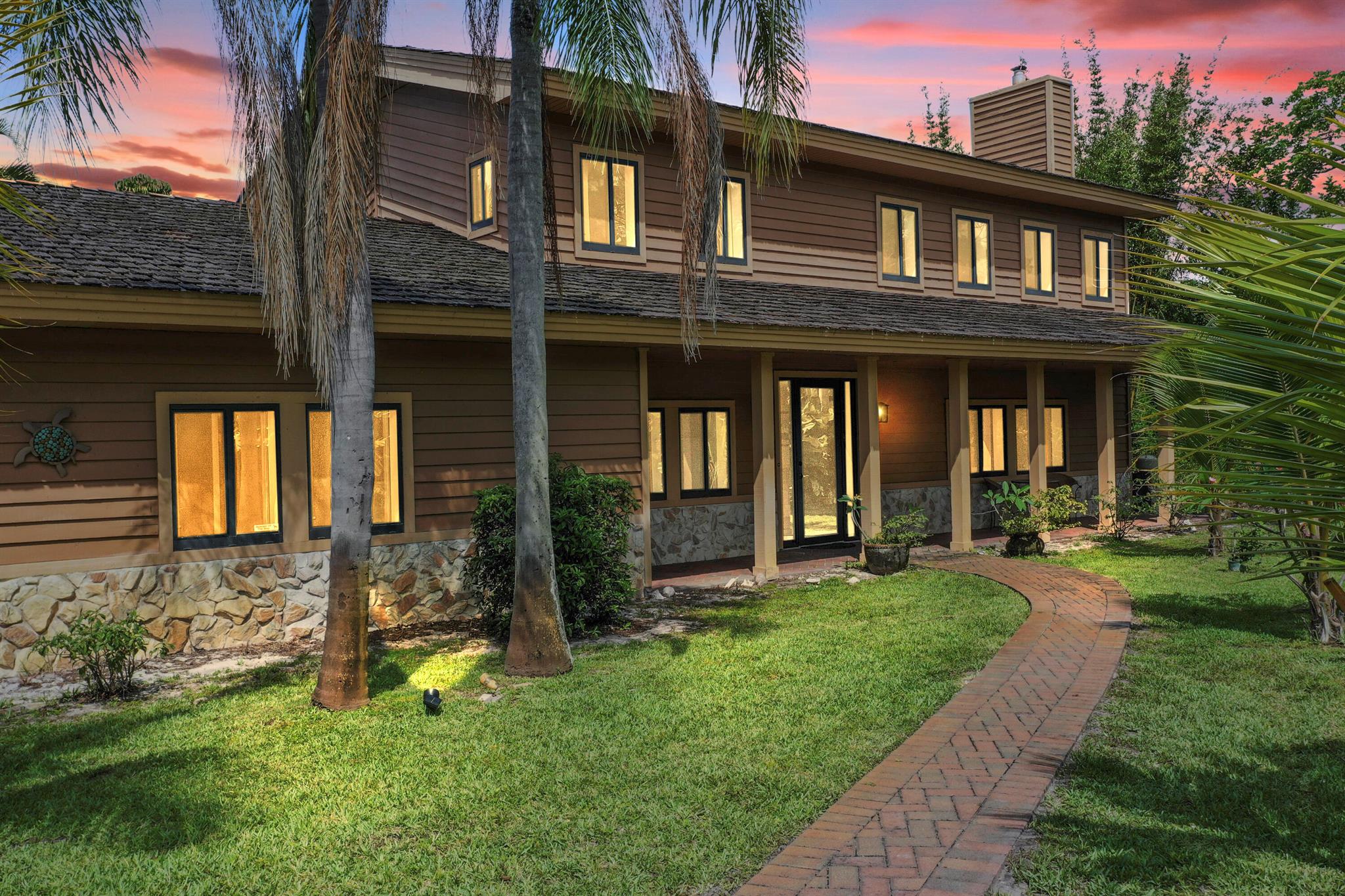 This Is It -Tranquility Meets Location in Jensen Beach! Welcome to this stunning home in Sugarhill, one of Martin County's most prestigious neighborhoods. Perfectly positioned on a private 1.1-acre lot bordering a wildlife preserve, this property offers the best of privacy, nature, and convenience. The home offers 4 Bedrooms plus den, 2.5 Bathrooms and 3-Car Garage. Also, the property features a spacious living room with a charming stone fireplace. The bright dining area is adjacent to and an open-concept family room/kitchen. Kitchen offers granite countertops, stainless steel appliances, and updated finishes. Impact glass doors open to a screened lanai and pool , perfect for year-round enjoyment.  Impact-rated newer doors and windows were added for security.  This home is a must see!