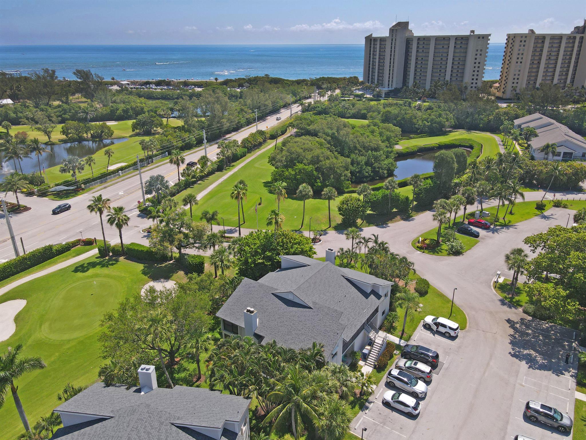 Live the beach life at 102 Clubhouse! This bright and breezy 2nd-floor condo is just a short stroll to the turquoise waters of Jupiter Beach. It's tucked between the ocean, DuBois Park, and Jupiter's beautiful estuary--so you get ocean breezes, golf course views, and gorgeous sunrises right from home. Inside you'll find two spacious bedrooms, two updated bathrooms, a cozy fireplace, and a private balcony off the living room. The unit also features a brand-new roof, a full-size washer and dryer, and a private storage closet for your bikes and beach gear.The community offers two pools, a clubhouse, and no mandatory fees.  Walking district to Love Street and restaurants with waterfront views. Whether you're looking for a weekend escape or everyday paradise, this one checks all the boxes.