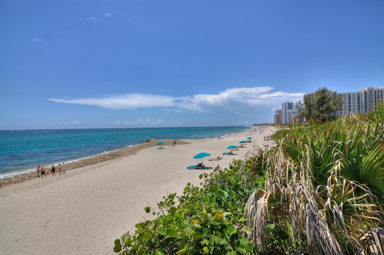 Fabulous completely remodeled east tower 2 bedroom 3.5 bath residence with the finest of updates!  This home. Faces SE with amazing views of the ocean and wide protected beach looking toward the Palm Beach Inlet. The west side of the condo faces SE and SW with enchanting city lights views in the evenings. Equipped with 2 parking spaces, an absolute must see at the Martinique.  New hurricane glass throughout!  Furnishings negotiable.