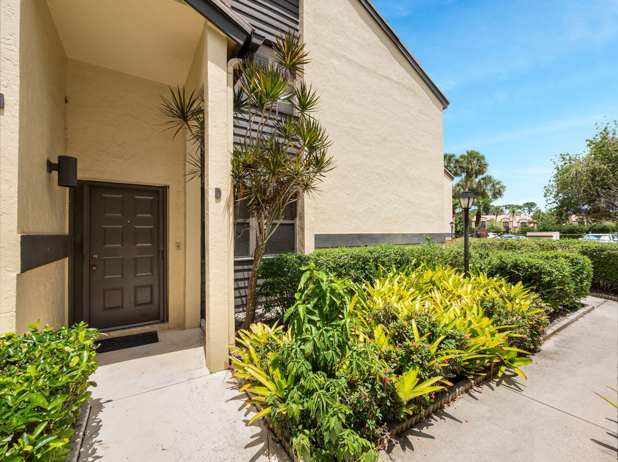 1st floor, 2BR+DEN/2BTH condo featuring amazing golf views of the 18th fairway! Light and bright, split plan with open kitchen & dining room! Spacious primary suite, w/walk in shower.  Guest bath has new tub & vanity, tile flooring in main areas & den. Bedrooms will need new flooring. Both have walk in closets! Den/Office w/built in shelves. Screened lanai to watch daily golf! Freshly painted interior. Commuters delight with convenient access to I-95 and Turnpike. Short walk to Clubhouse which features dining & many events you will not want to miss! Bring your finishing touches and make this your new home! Visit this beautiful, gated community in the heart of Palm City! All optional memberships available online at martindownsgolfclub, banyancreekgc, and villageclubpreserve!