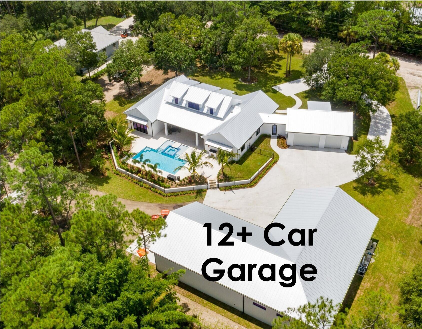 Crafted as the personal residence of a renowned custom builder, this exceptional one-story Coastal Farmhouse blends timeless design with modern functionality on a breathtaking 2-acre lot, surrounded by majestic old-growth oaks and palms on the north side of Indiantown Road.Spanning over 4,000 square feet of living space, this 4-bedroom, 4.1-bathroom home offers soaring 24-foot ceilings with designer beams, an expansive open-concept layout, and a seamless flow between indoor and outdoor living. A spacious 3-car garage is complemented by an impressive 12-car ''man cave'' garage with ceilings reaching over 20 feet--ideal for car enthusiasts, hobbyists, or anyone in need of serious storage.At the heart of the home is a spectacular great room and gourmet kitchen designed for both functionality and flair. Culinary enthusiasts will love the oversized 60-inch gas range, double farmhouse sinks, butcher block island, custom cabinetry, and walk-in pantry&#x14;perfect for entertaining while staying connected with guests.

Additional highlights include a generous mudroom, an oversized laundry room with ample storage, and premium finishes throughout.

Step outside through large sliding glass doors into a private outdoor retreat. The resort-style pool, expansive patio, and lush landscaping create a tranquil setting for sun-soaked afternoons or elegant al fresco dining under the stars.

Located just one lot off Indiantown Road, this hidden gem offers quick and easy access to shopping, dining, top-rated medical facilities, and major highways&#x14;including I-95 and the Florida Turnpike. Whether you're commuting or exploring the best of Jupiter, convenience meets serenity in this extraordinary estate.
