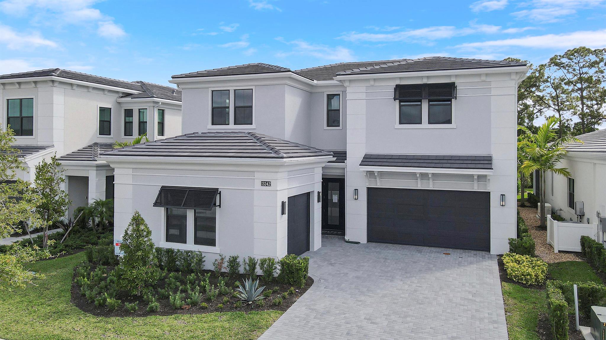 Experience elevated living in this spacious new construction home offering 4,000+ sq ft of luxury design and high-end finishes. The open floor plan features 2 elegant fireplaces, a first-floor owner's suite with coffered ceiling, spa-style bath, oversized shower, soaking tub, and large walk-in closet. The gourmet kitchen is a chef's dream with GE Monogram appliances, 42'' built-in refrigerator, gas cooktop, double wall ovens, 3'' Cambria quartz countertops, wine fridge, and custom cabinetry. Enjoy wide revwood flooring throughout, a striking wood staircase, abundant natural light, and convenient first-floor laundry. Upstairs, an oversized loft/club room includes a modern electric fireplace, wet bar, and is adjacent to 3 additional ensuite bedrooms--