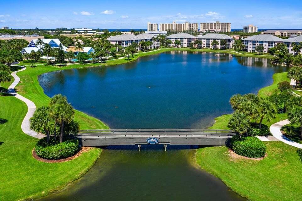 Fully furnished/appointed, this 2 story end unit townhouse in Jup Bay is a MUST See! 1340+ SF of Liv Space w/ plenty of natural light. Screened balcony overlooking lake. Located on the 3rd & 4th floors of an elevator building. Tile, vinyl laminate on first floor. Carpet in bedrms. Two Primary Bedrms with ensuite bathrms - both have walk in showers. Utility Room with full size washer/dryer.  Two Comm Pool, Tennis, Bocce. On site Restaurant. E-Z stroll to beach, shopping, restaurants, parks and Harbourside Entertainment Venue.  No rental restrictions. Yours to enjoy when convenient & rent out for income when you are not using.  Good rental potential to help defray carrying costs. Located in the heart of Jupiter.Seller will pay Concrete Restoration Assessment w/acceptable offer.