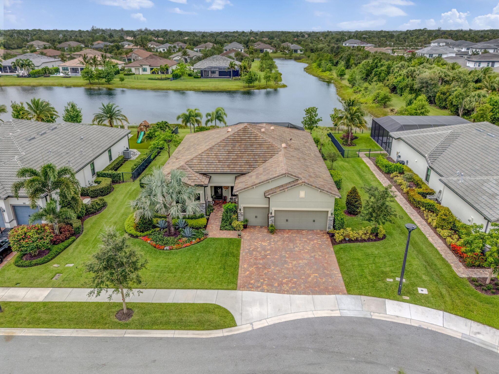 In The Highly Sought After Gated Boutique Community of Ancient Tree.This Stunning Luxury Estate Features Over $100K in Builder Upgrades in Pristine Condition. The Ultimate in Sophisticated Elegance is an Impeccably Designed 3 Bed/3 Bath plus Office/4th Bedroom Home. Complete with a Striking Open Floor Plan, It Features a Spectacular Great Room & Gourmet Kitchen Anchored by a Dramatic Fireplace/Tiled Wall with Breathtaking Lake Views. The Gourmet Kitchen is a Chef's Culinary Haven with Top-of-the-Line Cabinetry Finishes, High-End SS Appliance Package, and a Natural Gas Range. Vaulted Coffer Ceilings with Wood Accents, Porcelain Floors and Custom Closets Can Be Found Throughout. Impressive Landscaped Grounds, Unequalled Designer Touches & Construction Quality. Must See to Truly Appreciate.
