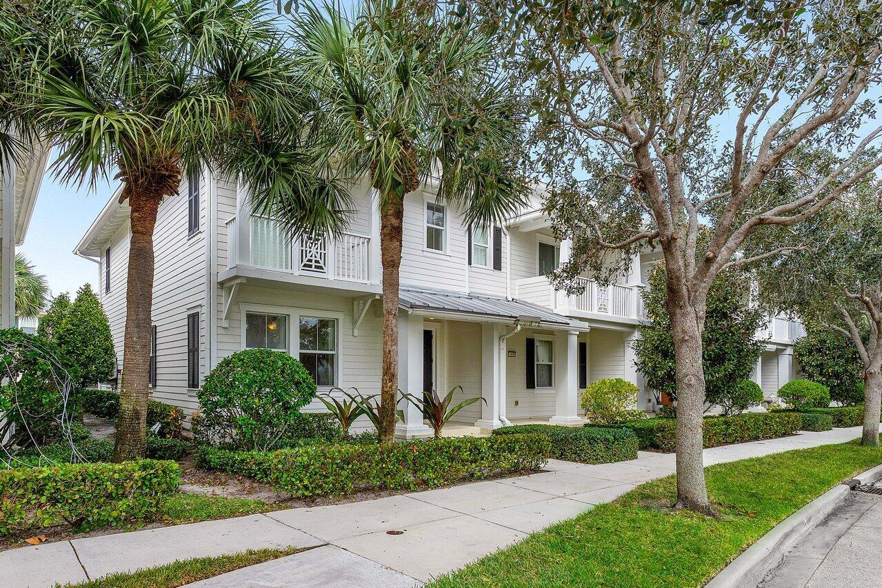 Lakefront Key West style end-unit townhouse located in Abacoa's most desired neighborhood Mallory Creek. Freshly painted from the ceilings to the baseboards. Home features plantation shutters throughout, new carpet, metal roof, impact windows/doors, and a large master suite with a balcony overlooking one of the 4 lakes within the community. This welcoming community equipped with a fitness center, clubhouse that hosts happy hours, movie night and holiday events. and 2 large neighborhood pools just steps away from your front door. All within walking distance you'll find the A rated Independence Middle School as well as Abacoa's Downtown area with fantastic restaurants & breweries, brand new Pickle ball courts and Roger Dean Spring Training Baseball Stadium.