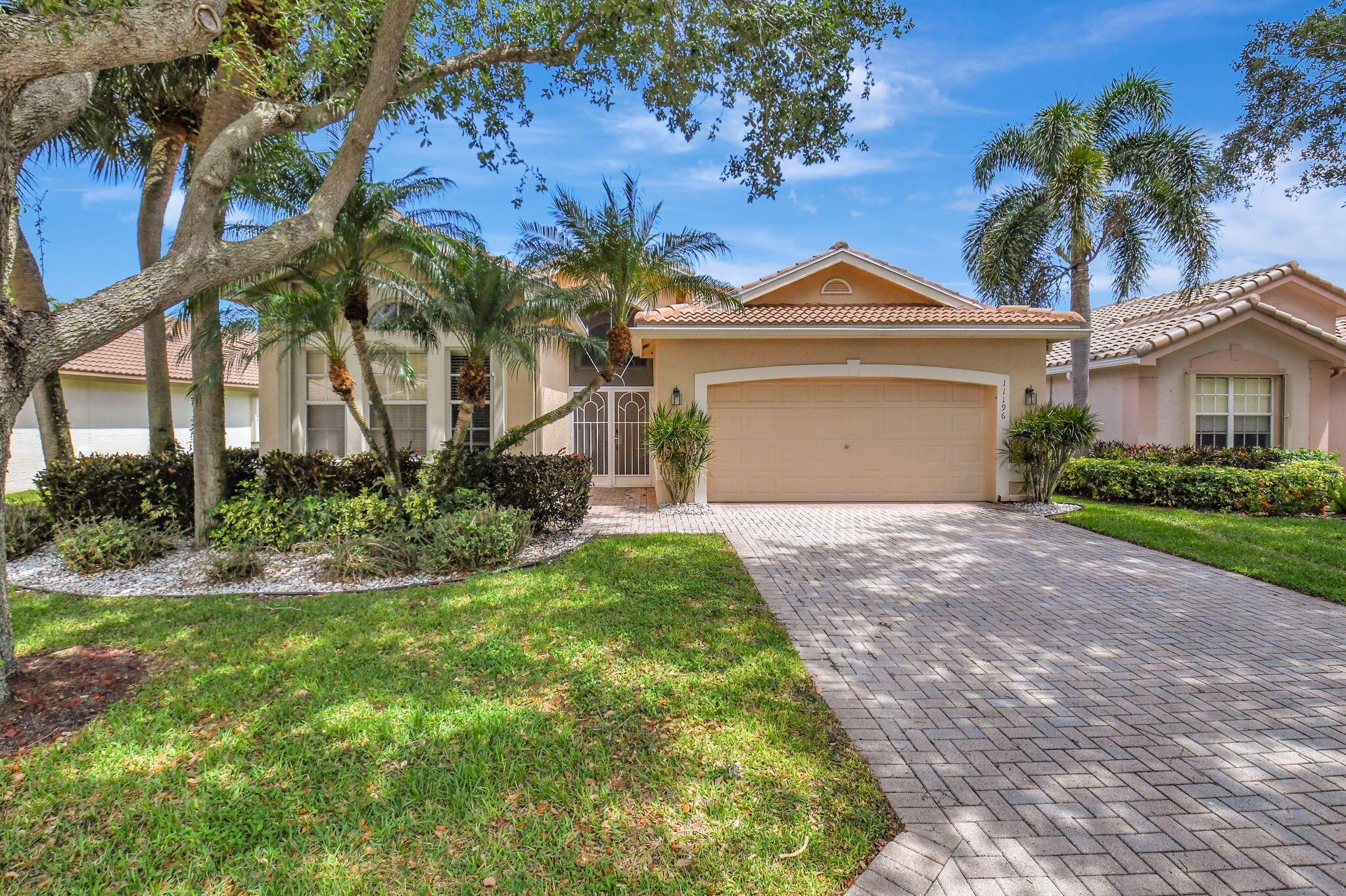 This popular Mediterranean model has outstanding water views from full length screened-in lanai to enjoy the morning sun for relaxing, reading or entertaining friends and family. New Roof 2022, New Hot Water Heater 2024, Newer A/C Unit 2017 w/UV System 2024. Accordian shutters complete for storm protection. This 3 bedroom/2 bath with den/optional 3rd bedroom is very well maintained, move-in ready with all furniture negotiable. This open-concept floor plan with high ceilings, tile on the diagonal in main living area designed for both style and function. The split bedroom design is ideal for privacy and comfort. Spacious Primary Suite is outfitted with his and her closets and luxurious en-suite bath. Laundry room equipped with laundry sink and abundant storage. Valencia Isles is a gated very active 55 plus community with two manned security gates. Within walking distance of the home is the Health Club with workout equipment, men and women locker rooms plus a large outdoor pool with sitting area The main Clubhouse (renovated in 2019) has social hall, multiple card rooms, aerobics studio, arts and crafts room, billiards, meeting/conference room, with on-premise Bistro. Many clubs within the community and entertainment. There is a main pool, lap pool, fishing pier, 6 tennis courts, 2 pickleball courts (4 additional pickleball courts and 2 bocce ball courts have been approved and paid for). Close to shopping, restaurants, beaches, the ocean, downtown Delray Beach and West Palm Beach airport.