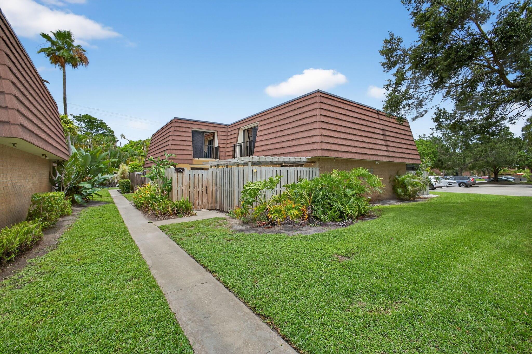 Fantastic location in the quiet, west side of the neighborhood. Easy access gate to walk or bike the kids to the zoned A rated elementary & middle schools plus the North County recreational park! Unit has new roof and gas hot water heater in 2018. New A/C 2019. Wood cabinets, granite countertops, newer Whirlpool appliances. Front loading washer & dryer in half bath downstairs. Fully enclosed 3rd bedroom/office/den on first floor. Custom barn door privacy to master bedroom dressing area. Updated bathrooms. two assigned parking spaces. Patio offers cooler morning sun and shaded afternoons & evenings for enjoyment.  Pet friendly neighborhood with no weight limit! Playground, tennis, pickleball, lakes, benches, sidewalks, adjacent to grocery, restaurants. Easy I-95 or turnpike access!