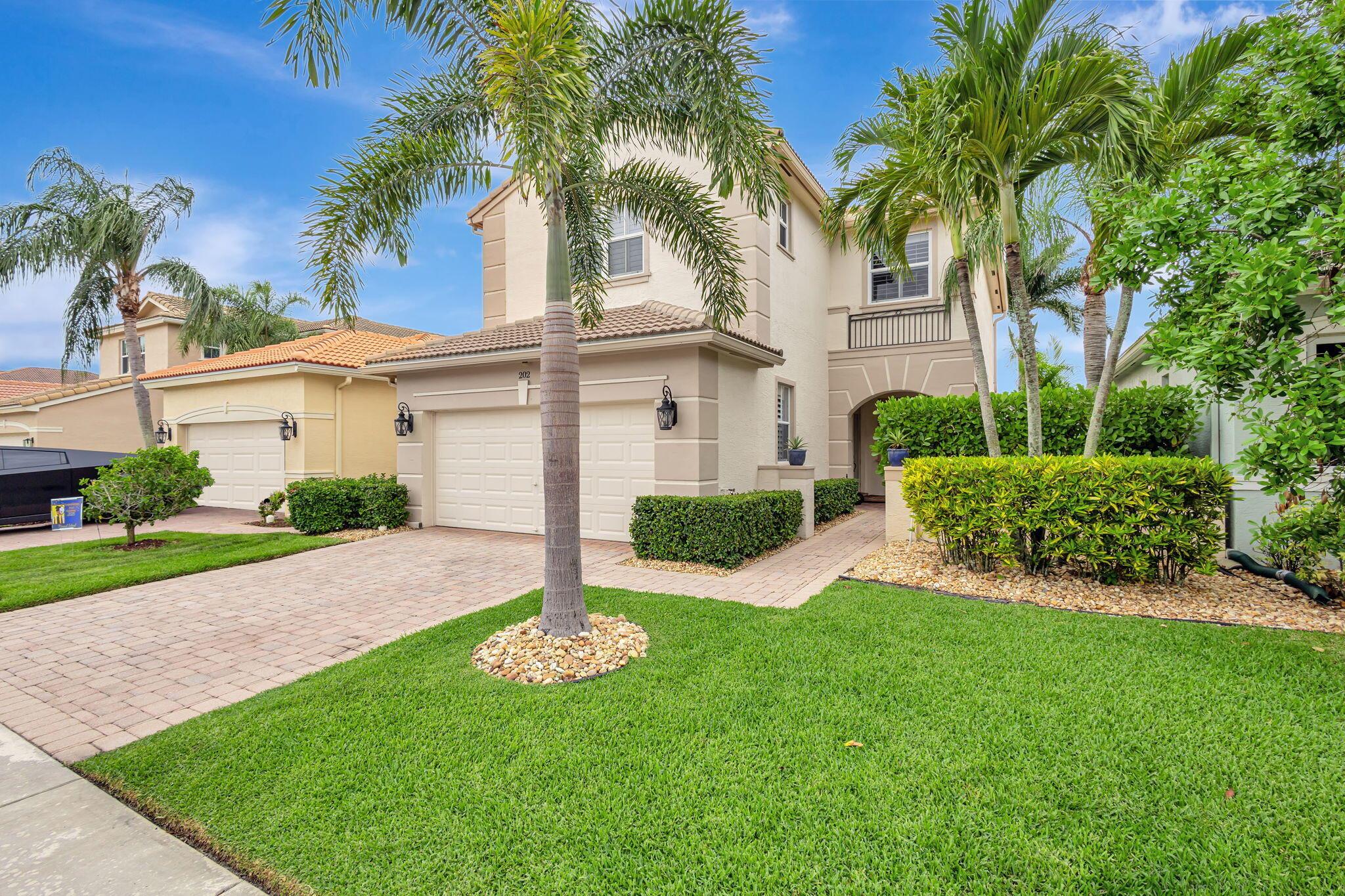 Nestled within the prestigious, guard-gated enclave of Mirabella, this exquisitely upgraded residence offers four spacious bedrooms plus a versatile den--ideally positioned on the main level with an adjacent full bath, easily convertible to a fifth bedroom--encompassing over 3,270 square feet of elegantly appointed living space tailored to today's discerning buyer. A grand two-story layout combines timeless architectural details with sophisticated, contemporary renovations, creating a home that is both inviting and impressive. The heart of the home is a fully reimagined gourmet kitchen, completed in late 2022. No detail was overlooked--from custom cabinetry and premium KitchenAid appliances to soft under-cabinet lighting and striking glass-front cabinets with illuminated interiors. Designed for both form and function, this space is ideal for entertaining and everyday living alike. Throughout the residence, thoughtful enhancements elevate the home's style and comfort. Whole-house crown molding adds a touch of elegance, while rich engineered wood flooring on the staircase and second level introduces warmth and character. Upstairs, impact-resistant windows offer both security and peace of mind. Modern conveniences abound, including two brand-new Carrier HVAC systems installed in 2023, each with updated air handlers, condensers, and smart thermostats for optimal climate control. A Wi-Fi-enabled garage door opener with an integrated security camera adds convenience and peace of mind, while the whole-house surge protector and newly installed exterior outlets provide added safety and functionality. The bathrooms have received tasteful updates, including new Kohler toilets and vents. All four upstairs bedrooms feature thoughtfully designed custom-built closets, including two impeccably outfitted by California Closets, that offer stylish, tailored storage solutions. Plantation shutters were thoughtfully added to glass block windows. Additional upgrades include updated light fixtures, ceiling fans, new landscaping, and a secondary garage refrigerator, all reflecting the current owner's meticulous attention to detail. With a brand-new roof installed in 2014, this residence represents an exceptional opportunity to own a move-in-ready home of distinction in one of Palm Beach Gardens' most desirable communities. Mirabella offers resort-style amenities, lush surroundings, and proximity to world-class dining, shopping, golf, and beaches&#x14;making this the ultimate South Florida lifestyle address.
