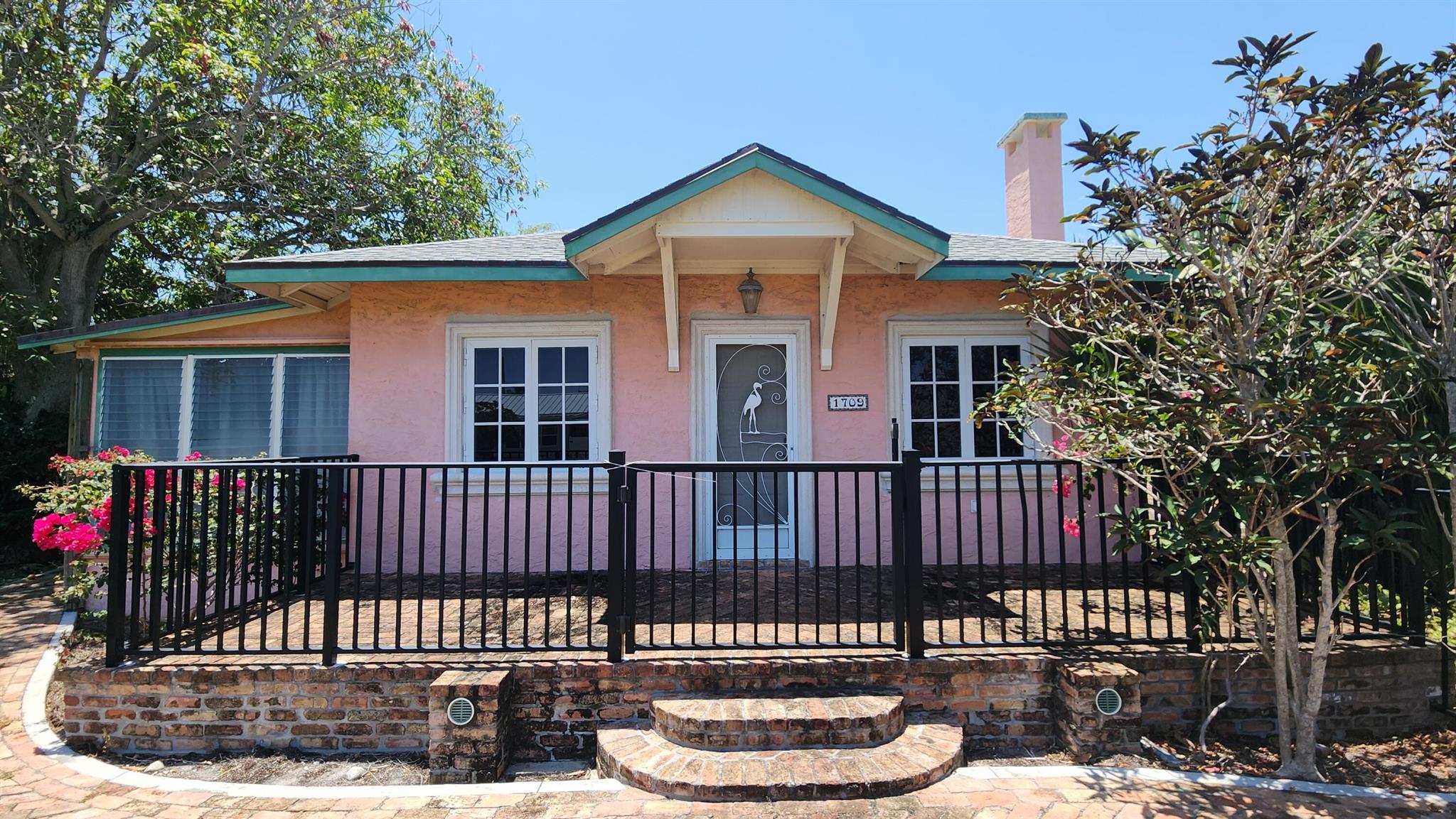 Incredible opportunity to remodel or build your dream home on a spacious double lot, just a few blocks from the Intracoastal! This property features multiple structures, offering endless potential. The main home has been taken down to the studs and sub-flooring, providing a blank canvas for your vision--it previously included two bedrooms, two bathrooms, a kitchen, and two sitting rooms. Additional buildings include a charming studio and a detached two-car garage with a small workspace. The extra-large lot provides ample space for expansion or new construction. Beautiful Chicago brick driveways and walkways add character and curb appeal. Don't miss your chance to create the perfect home in this sought-after location! The lot can be split into two 75' wide parcels per the City of LW.