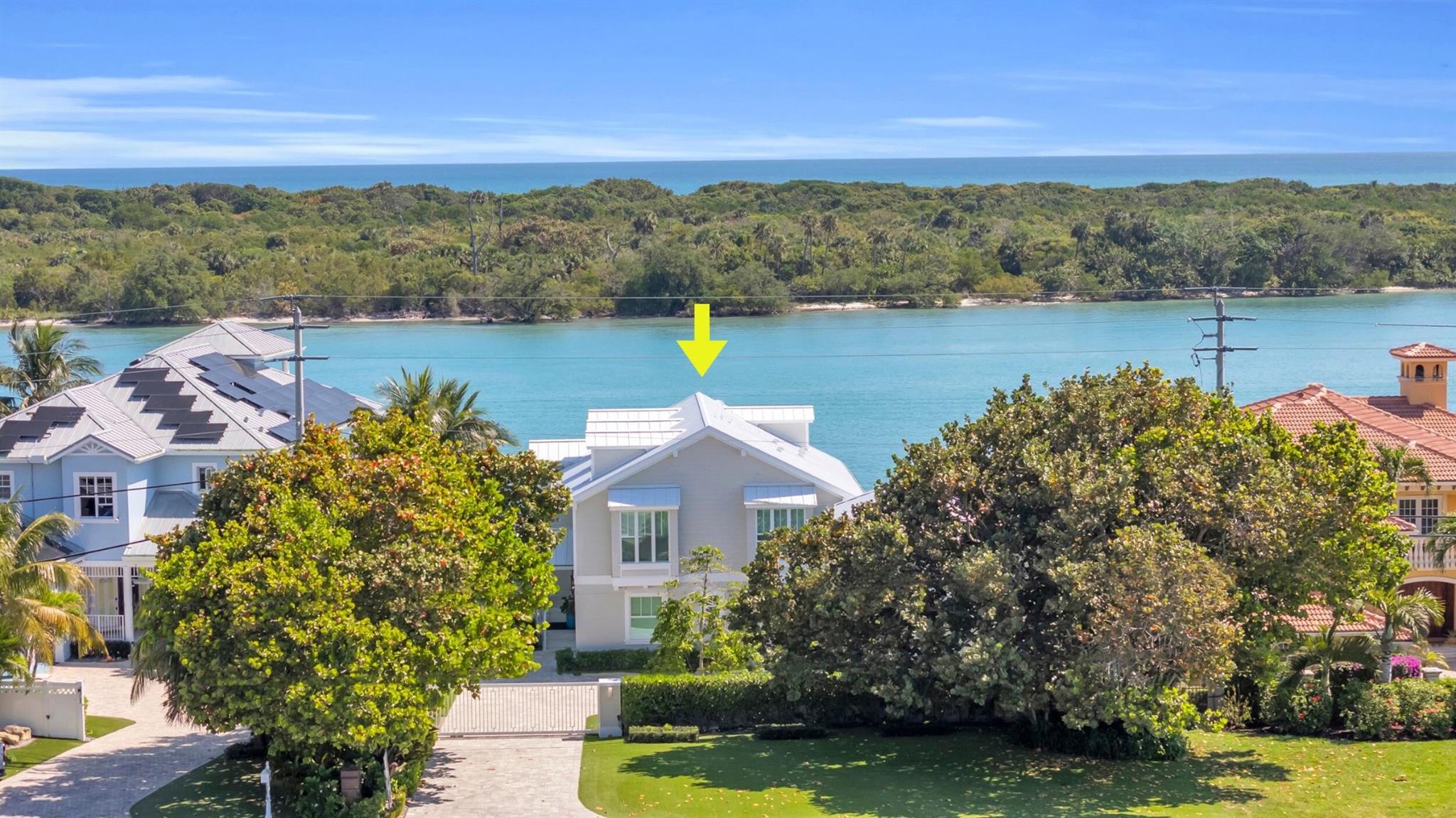 MULTI ZONING on the BRIGHT BLUE IntraCoastal Waterway!  This 2021 Luxury Residence offers multiple options with 2 guest apartments, a separate entrance office, a main house to be rented separately.  Rent the Dock separately.  Perfect set up for a business owner to utilize office space and rent back residential space. Private sandy beach just beyond the 24 x 48 pool and spa.  This gated property is within minutes of shopping and dining AND minutes to the Jupiter Inlet!  See Documents and Floorplans for more info.  AMAZING OPPORTUNITY!