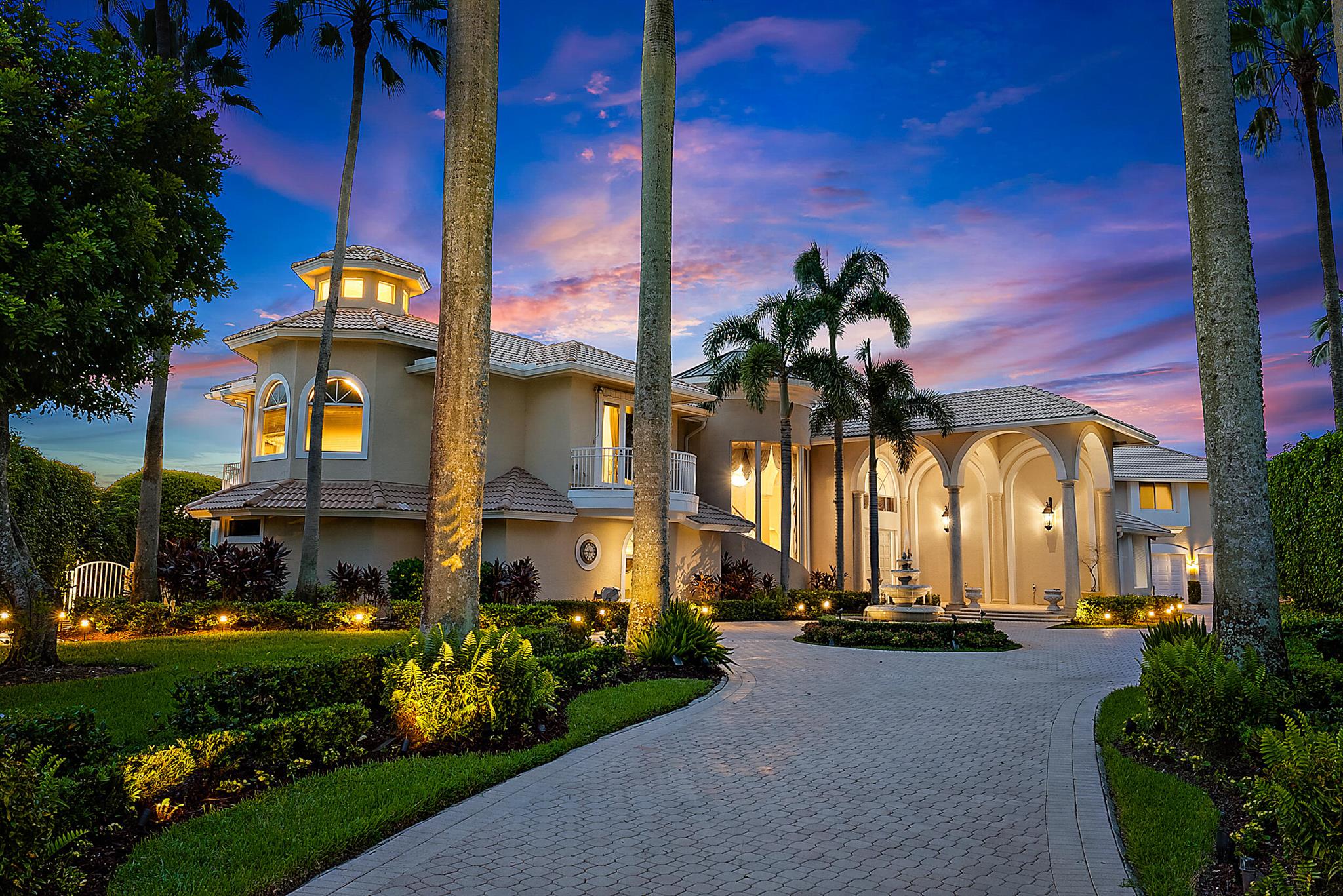 This Cribb-built custom masterpiece boasts a premium .58-Acre lot with private golf course access and is located within quick walking distance to the world-class amenities at the Club at Ibis. Location, Location, Location! With 200 FEET OF WATER FRONTAGE, this home offers breathtaking golf and lake vistas from numerous vantage points and balances privacy with incredible curb appeal. Its discrete location, nestled in the cul-de-sac, and its elongated private driveway and Romanesque fountain set the tone for the grand scale of this ICONIC IBIS ESTATE. With soaring ceilings and picturesque views throughout, this architecturally exciting, home has been designed to impress and pamper. The marble spiral staircase is a dramatic focal point, epitomizing estate luxury at its finest. This masterfully built and fastidiously maintained 6BR home boasts 6 Full Baths and Two Half Baths. All bedrooms are ensuites and there is a full mother-in-law apartment attached to the main house&#x14;it's like two residences in one. All new HVAC systems were installed in 2023 with Honeywell wireless thermostats: (7 total; 4 split systems and 3 mini-splits.) With 7707 sf under air, there are two primary suites; one upstairs and one downstairs. The upstairs primary suite is 1600 sf and boasts a loft, sitting room, ample closet space, and opulent bathroom. Enjoy sweeping post-card perfect views from the balcony. A space has been reserved for the installation of an elevator, if the new owner wishes. The versatile floor plan was designed to accommodate family, houseguests, and live-in help, while offering privacy and luxury in one of the most unique and ideal type of lots found in any country club in South Florida. Opulent and dramatic interior styling with impeccable workmanship bring to life this iconic property&#x14;inside and outside. Custom touches create the epitome of luxurious country club living: two full gourmet kitchens and two full laundry rooms, plus a custom sauna, custom engineered outdoor landscape lighting, high-end light fixtures, sconces, custom window treatments and draperies (2019) and custom wallpaper (2019). The recently customized sun room graciously expands the interior space to the magnificent views and outdoor space. The swimming pool was completely refinished in 2023, and the patio was redone with timeless marble pavers. The interior was painted and high-grade carpeting was installed in 2023 as well as new 7" gutters with downspouts and splash guards, and a new tankless on-demand water heater&#x14;all in 2023. Toto electric Washlet toilets, a custom stereo system as well as Central Vacuum system were also installed in the home. Ample storage offered throughout this residence. With 200 feet of water frontage on the western side and 100 feet of golf course views on the northern side, this lushly landscaped and manicured property offers a large yard space, with world-class amenities of the Club at Ibis literally in your backyard. There are several balconies/sunning decks that offer incomparable views of golf and lake vistas including the 18th green of the Heritage, as well as Heritage #10. One of the few properties in Ibis to enjoy private golf course access. This widely recognized estate offers two things that rarely go hand in hand: a large country club estate property and close proximity to the Club itself. The Club at Ibis is an award-winning community that boasts a 90,000 sq. ft. clubhouse, three 18-hole Nicklaus-family Championship golf courses, five restaurants, a world-class fitness complex and spa, and incredible tennis and pickleball facility&#x14;all located within steps of this magnificent property. SELLER IS OFFERING A $250,000 CREDIT TOWARD THE BUYER'S FUTURE IMPROVEMENTS AND IS ACCEPTING BEST OFFERS.