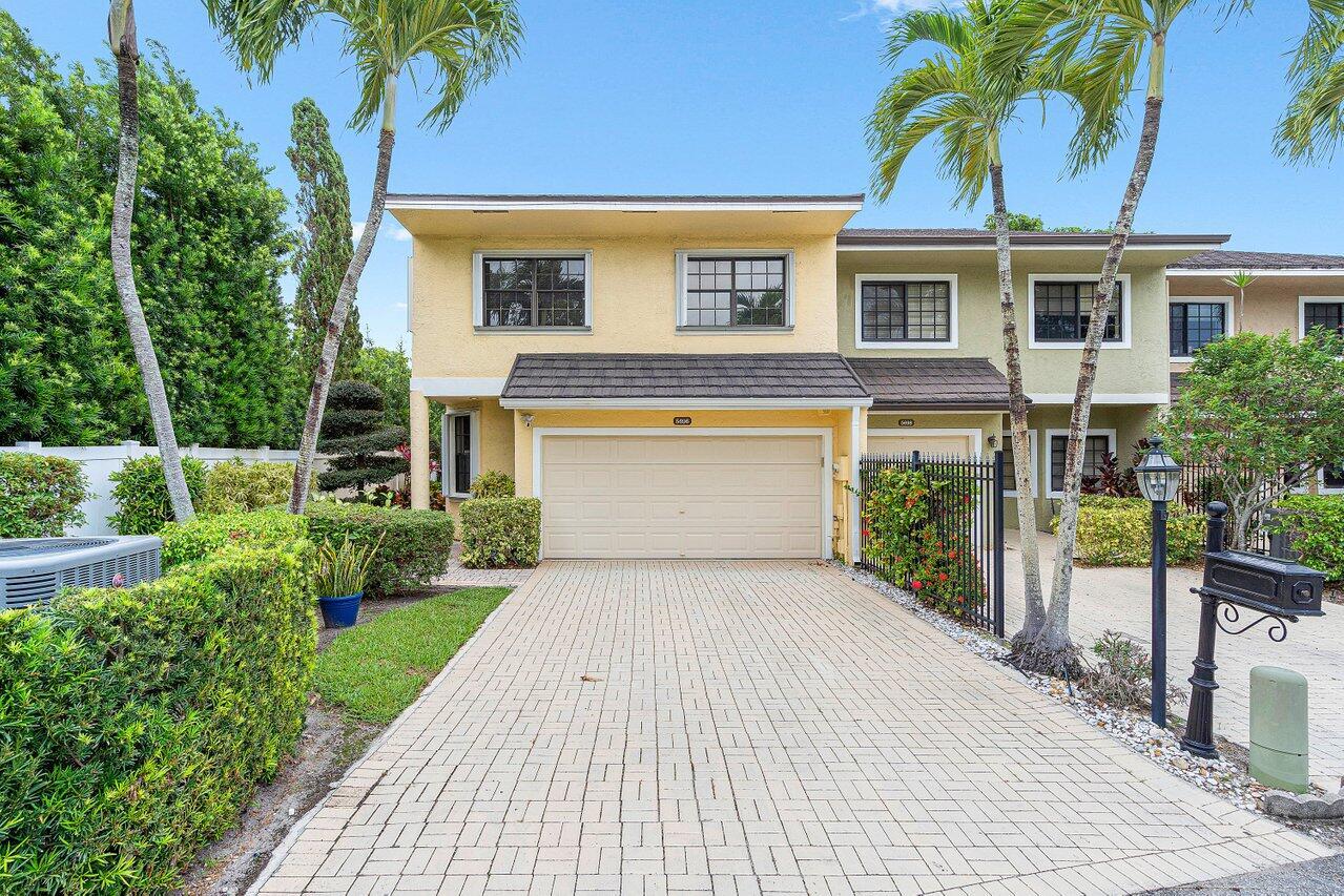 Quiet oasis end unit 3 bedroom, 2.5 bath townhouse on end of cul-de-sac within the best school district in the S. Florida that has been meticulously maintained, renovated, and updated. Two car garage, and private rear deck with a pool and plantings makes for a calming refuge, while inside a recently completely renovated master bath completes your personal pampering. Over 2,000sq ft of modern living space includes very large master suite. Tile on 1st floor and wood on 2nd completes the luxury touches. Third floor loft offers storage or living options. Recent appliances are included with one year old high-end refrigerator. New metal roof in 2022, accompanied with new awnings and gutters at same time. Private pool refinished in 2021, and deck refinished with flagstone look in 2023. 6-year-old AC unit with new evaporator coil in 2024. Included in sale is a 12,500w generator that has been integrated into the house's electrical system to ensure seamless integration. Generator can provide 100% backup power in the event of power outage. Conveniently located just minutes from top-rated A+ schools, the beach, FAU, Mizner Park, dining, shopping and more.