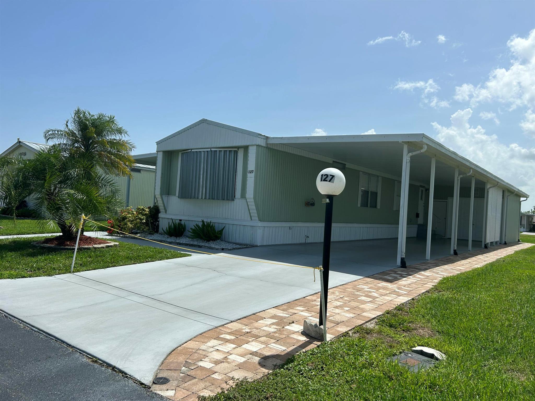 This well-cared-for, move-in ready home offers comfort, convenience, and charm! Fully furnished and thoughtfully maintained, it features a cozy Florida room perfect for relaxing or entertaining. The attached carport includes a workshop area, ideal for hobbies or extra storage. Whether you're looking for a full-time residence or a seasonal retreat, this home is ready for you to move in and start enjoying! This active 55+ community has a clubhouse, heated pool, pickleball, shuffleboard, and billards for your social events and enjoyment.