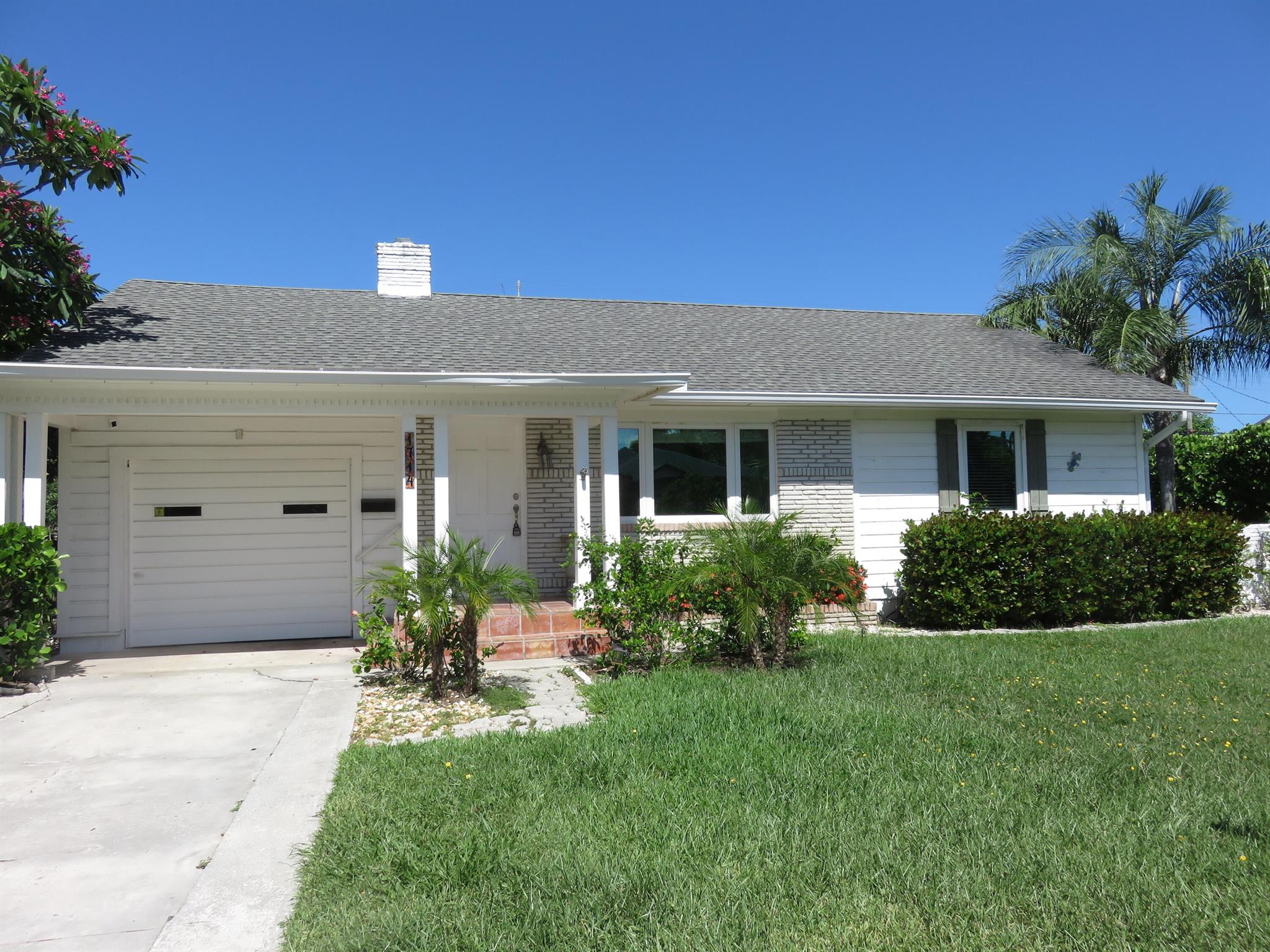 CHARMING COASTAL RETREAT IN EDEN PLACE NESTLED IN THE SOUGHT- AFTER NORTH END OF LAKE WORTH BEACH, JUST STEPS FROM THE INTRACOASTAL WATERWAY. THIS RADIANT SINGLE-FAMILY GEM SITS IN THE HEART OF THE BELOVED EDEN PLACE NEIGHBORHOOD WHERE TREE LINED STREETS, CLEAN OCEAN BREEZES, AND OLD FLORIDA CHARM MEET MODERN CONVENIENCE SET ON AN EXPANSIVE 9,500 SQ FT FULLY FENCED IN  LOT (95X100). THE HOME IS SURROUNDED BY LUSH TROPICAL  LANDSCAPING OFFERING BEAUTY, PRIVACY, AND AMPLE SPACE TO ADD YOUR DREAM POOL IN A GARDEN OASIS. STEP INSIDE TO FIND A BRIGHT AND SPACIOUS LAYOUT FEATURING A SUN-DRENCHED FLORIDA ROOM WITH CLASSIC MEXICAN TILE, A LARGE , OPEN CONCEPT KITCHEN, WITH STAINLESS STEEL APPLIANCES AND INVITING LIVING SPACES FILLED WITH CHARACTER AND NETURAL LIGHT. WHETHER YOU'RE SIPPING COFFEE