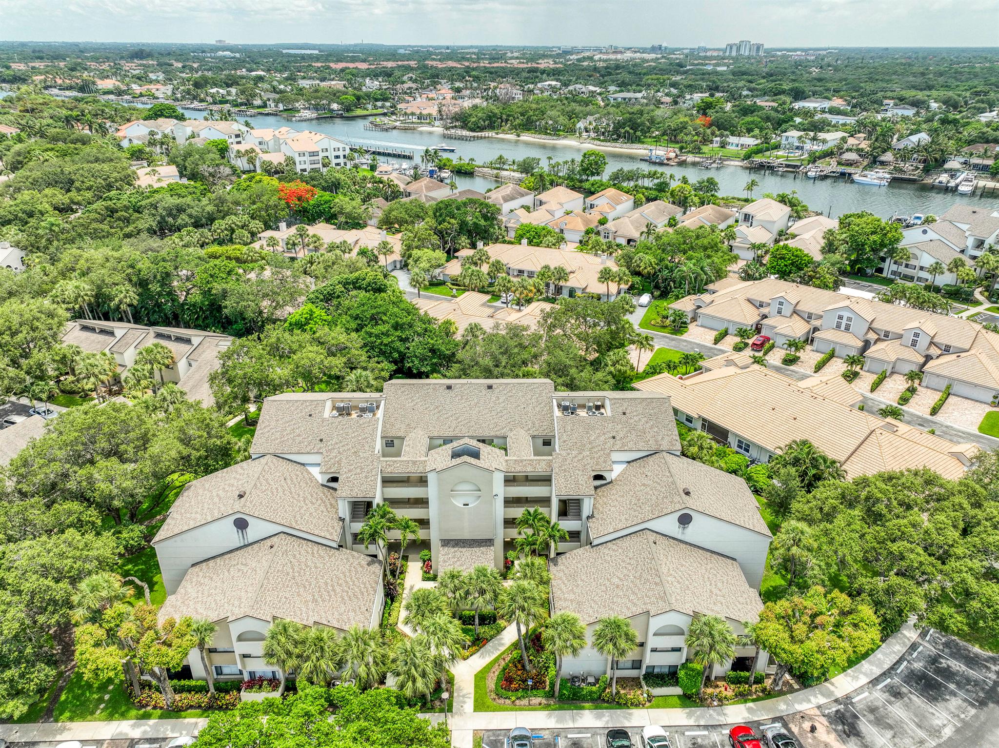 Renovated contemporary-style 2BR/2BA condo in Juno Beach's gated waterfront community, Oak Harbour. Enjoy an open floor plan with kitchen bar-top seating, a separate dry bar for entertaining, and a private primary suite. The enclosed patio adds additional living space or can be opened up for a breezy outdoor setting--surrounded by lush greenery and mature oak trees for both privacy and a peaceful view. Oak Harbour offers 24/7 manned security and resort-style amenities, including a marina with available boat slips, two pools, tennis courts, and a clubhouse. Ideally located just minutes from Jupiter's pristine beaches, top-rated dining, shopping, and major roadways. Whether you're seeking a full-time residence or a luxury seasonal retreat, this move-in ready home offers the best of Jupiter's