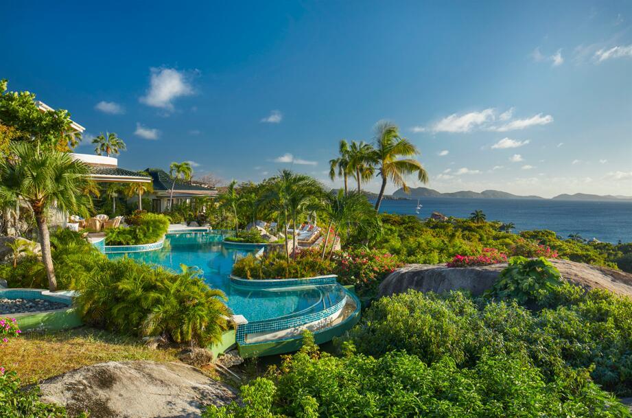 Refined resort-style living awaits at this recently renovated Virgin Gorda, British Virgin Islands generational 'Valley Trunk' enclave on landscaped 18 freehold acres with 1,100+/- feet of Caribbean white-sand beachfront, overlooking dazzling Sir Francis Drake Channel views. Living areas of the ten-bedroom villa open to the freeform 80-foot infinity pool, while the tennis court adjoins the four-bedroom guest villa. Features include a modern interior redesign with a coastal aesthetic; cinema screening room; lounge with a wet bar; luxe primary suite offering panoramic views of the ocean, islands and sunset; separate manager's house-staff accommodations. wander garden pathways to explore your property's flora and fauna, play in the rock pools, snorkel in dramatic underwater seascapes! DISCLAIMER: Information published or otherwise provided by the listing company and its representatives including but not limited to prices, measurements, square footages, lot sizes, calculations, statistics, and videos are deemed reliable but are not guaranteed and are subject to errors, omissions or changes without notice. All such information should be independently verified by any prospective purchaser or seller. Parties should perform their own due diligence to verify such information prior to a sale or listing. Listing company expressly disclaims any warranty or representation regarding such information. Prices published are either list price, sold price, and/or last asking price. The listing company participates in the Multiple Listing Service and IDX. The properties published as listed and sold are not necessarily exclusive to listing company and may be listed or have sold with other members of the Multiple Listing Service. Transactions where listing company represented both buyers and sellers are calculated as two sales. "No payments made until title passes" Some affiliations may not be applicable to certain geographic areas. If your property is currently listed with another broker, please disregard any solicitation for services. Information published or otherwise provided by seller, listing company or its representatives is deemed reliable but are not guaranteed and subject to errors, omissions, or changes without notice. Copyright 2025 by the listing company. All Rights Reserved.