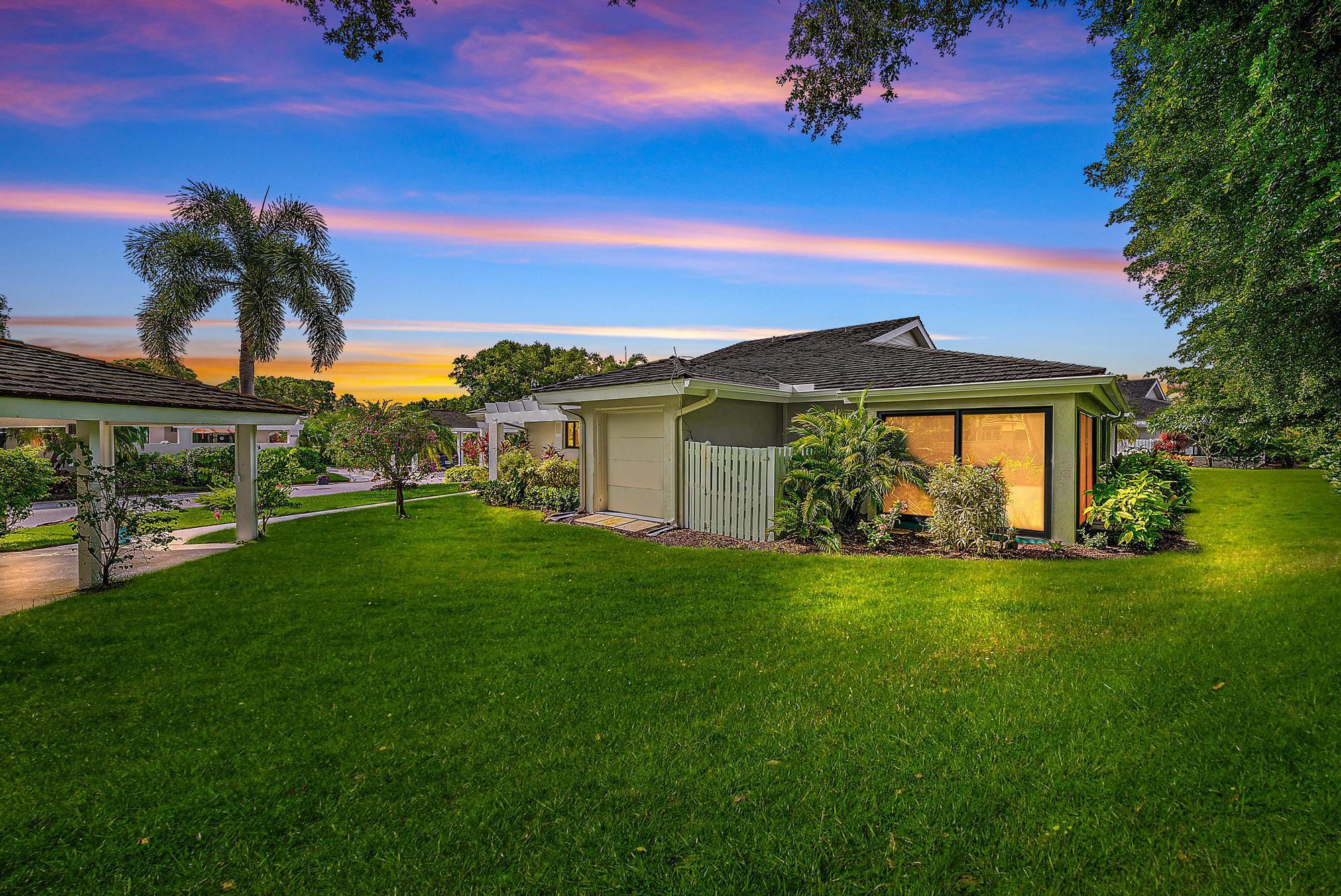 Beautifully renovated and turnkey, this 2-bedroom, 2-bathroom first-floor end-unit villa is located in a prime spot within Jonathan's Landing near the club. Professionally decorated and furnished, the home features new luxury flooring throughout, a redesigned kitchen that opens to a spacious courtyard, and an enclosed Florida Room overlooking lush garden views. Additional upgrades include all-new impact windows and doors, beautifully updated bathrooms, a new roof put on in 2019, Newer AC and ductwork, upgraded electrical panel and lighting, and a large storage closet. The property also offers a full-sized carport, golf cart garage, extra parking, and beautifully landscaped surroundings. JL offers a premier lifestyle close to beaches, shopping, and dining.